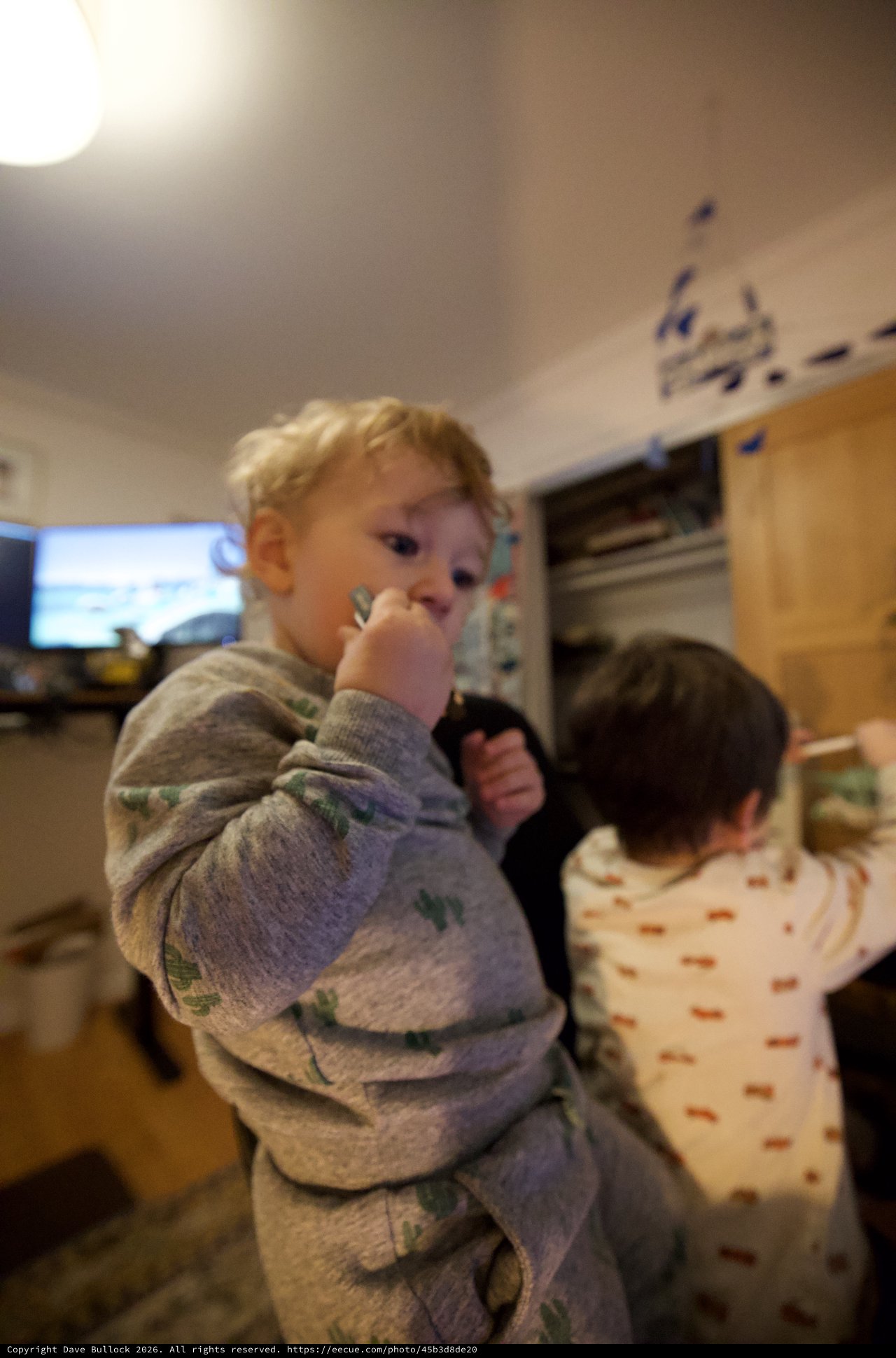 Young Children in Pajamas at Home in Kitchen
