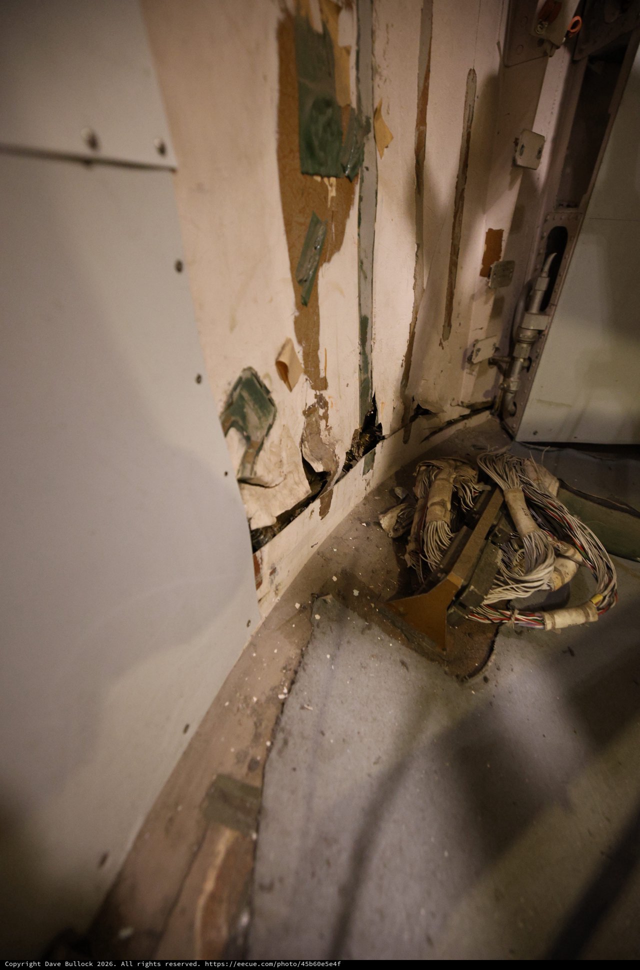 Deteriorated Door Frame with Exposed Wiring on USS Hornet