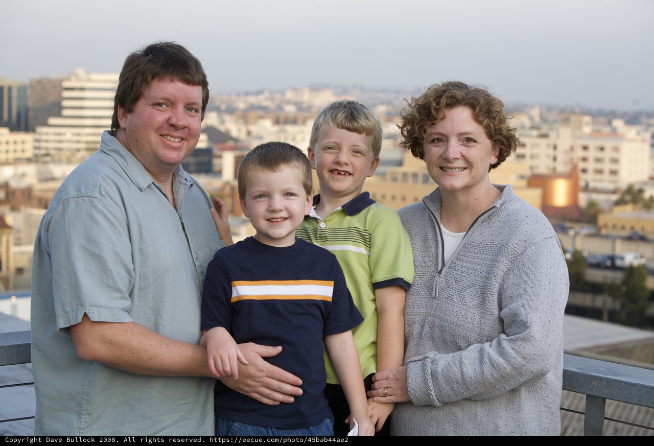 Family Portrait on Urban Rooftop at Dusk