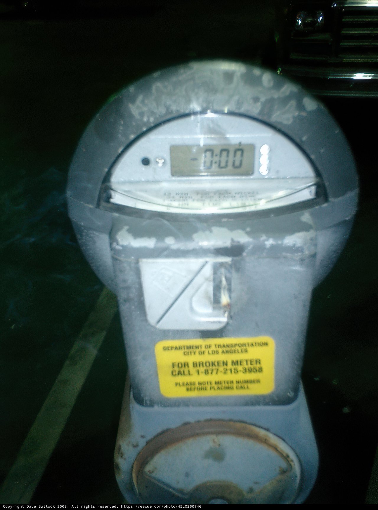 Parking Meter in a Busy Parking Lot