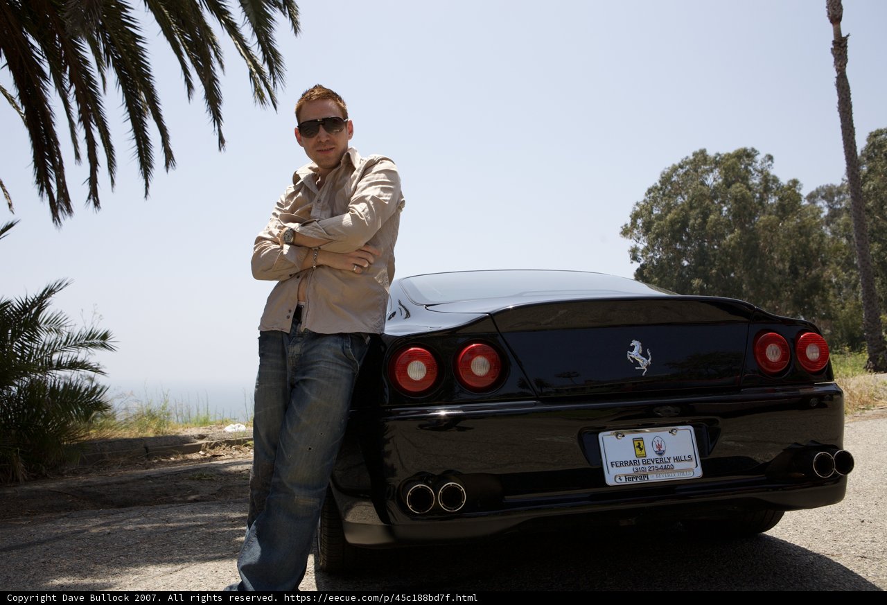 Standing by a Ferrari