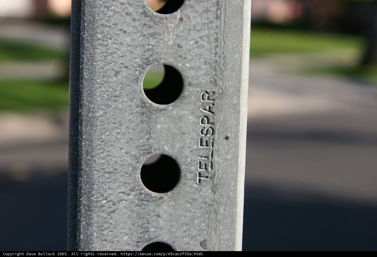 Hole-ridden Street Sign