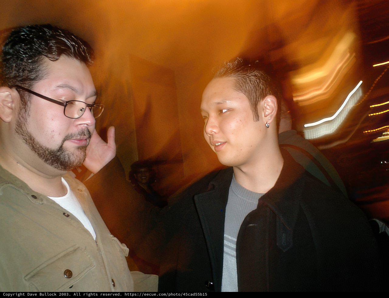Blurry Portrait of Two Men in Urban Area