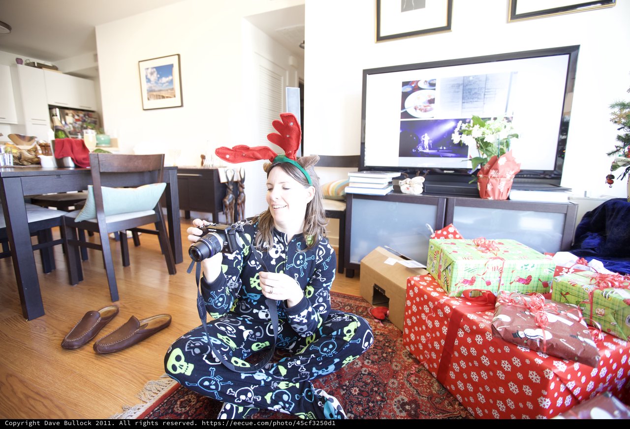 Christmas Morning Joy with Camera and Reindeer Antlers