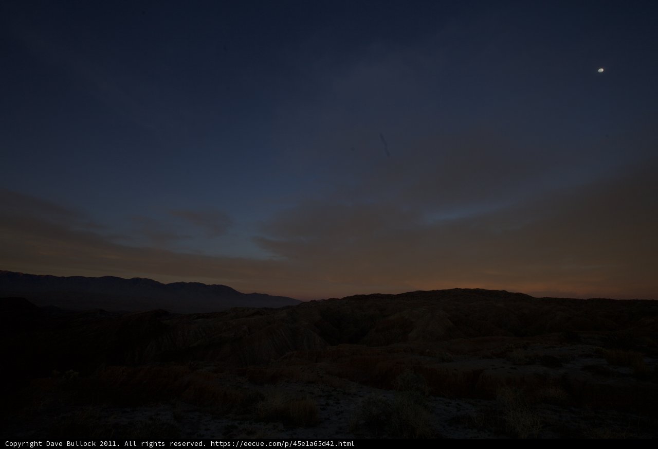 Moon and Plane in the Desert Sky