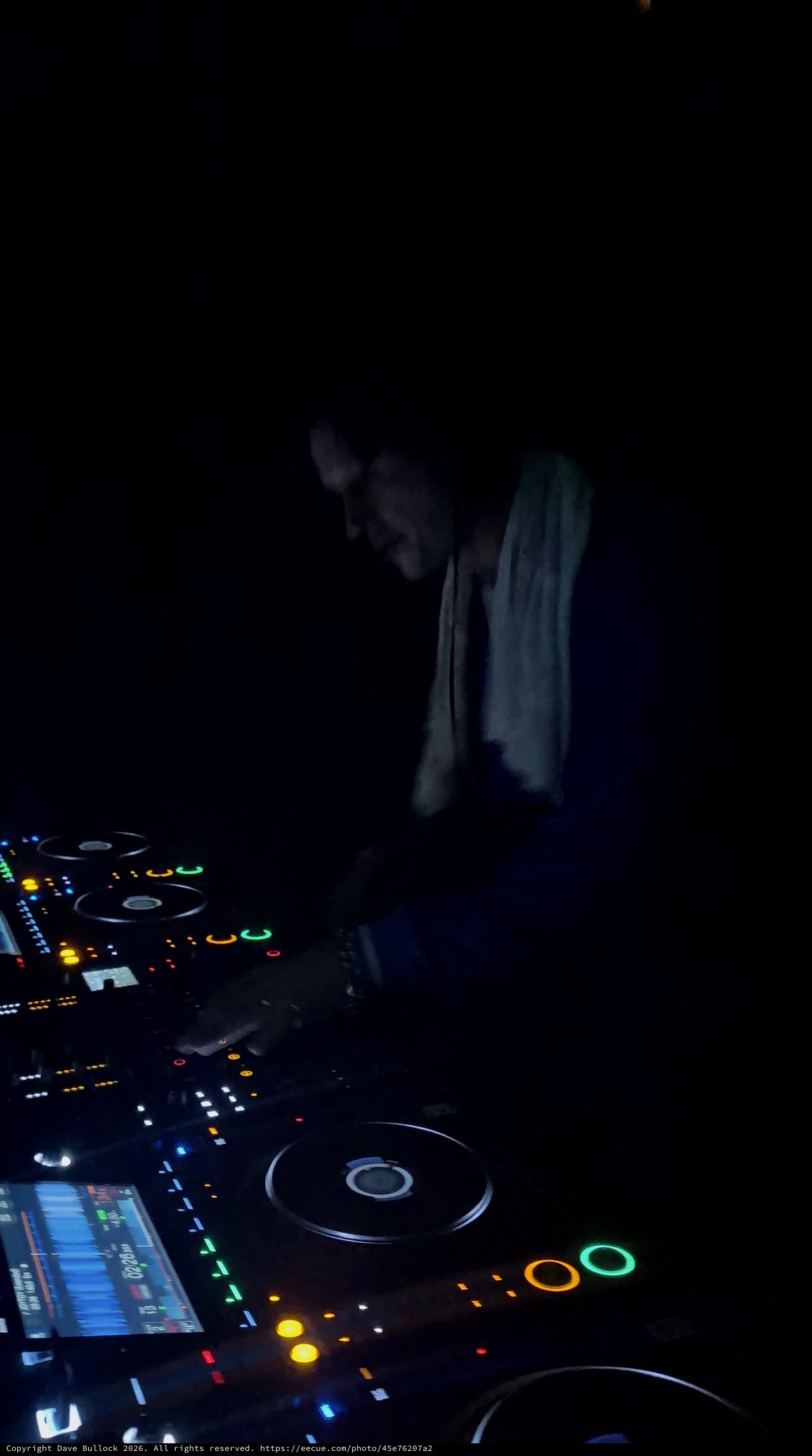 DJ Performing with Pioneer Equipment in Dark Club