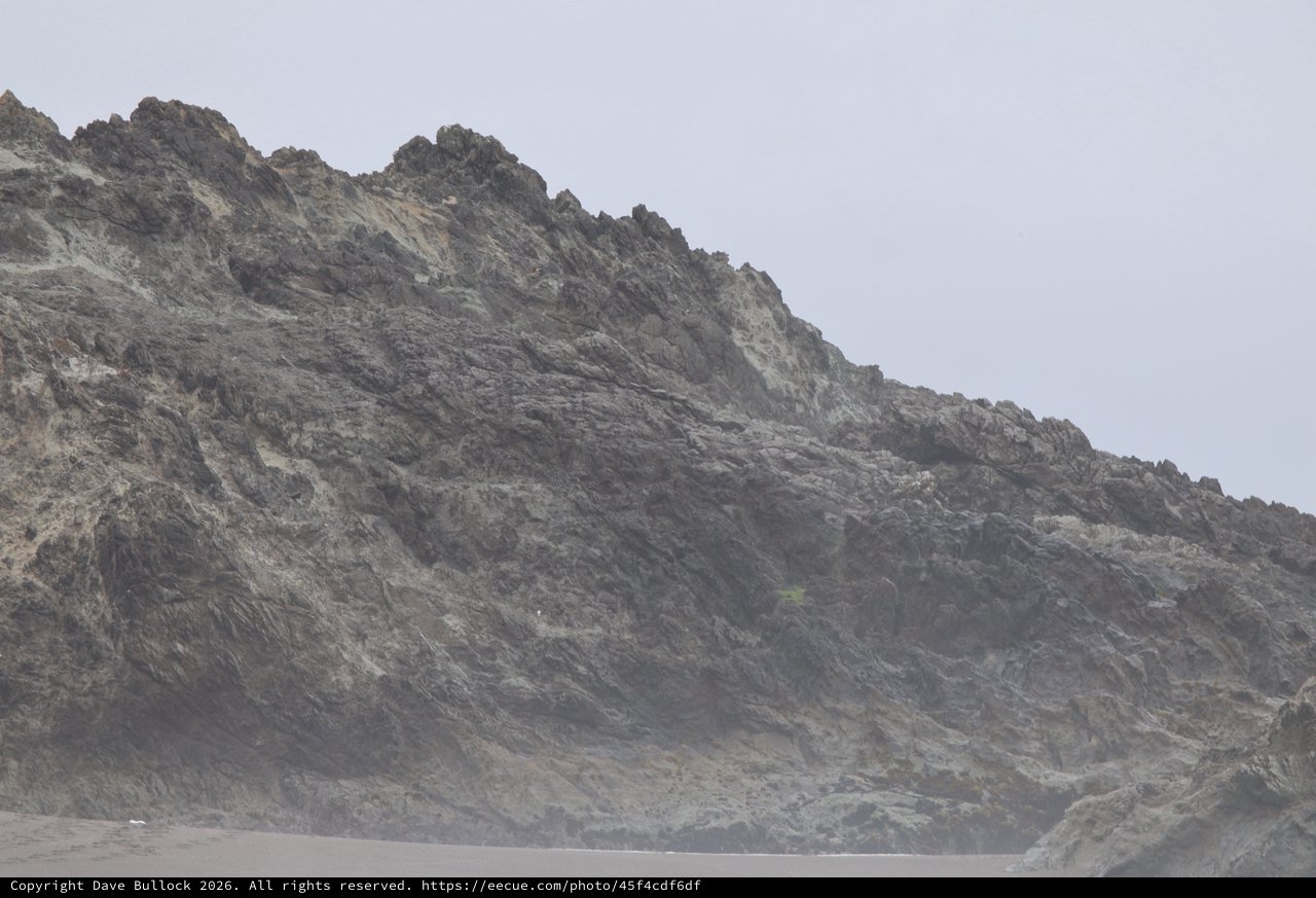 Jagged Coastal Cliffs Shrouded in Ocean Mist