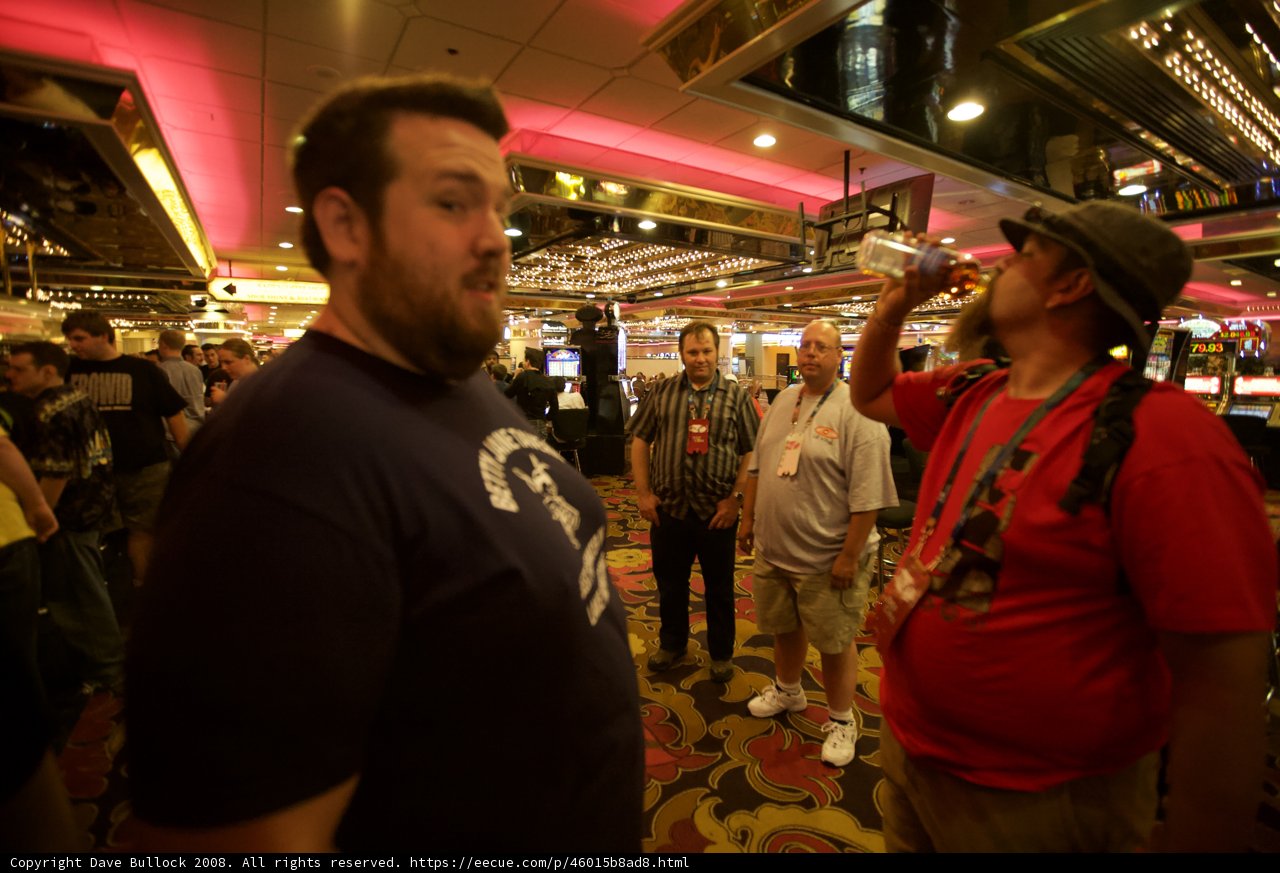 Man in Hat Enjoying Night Life at Casino