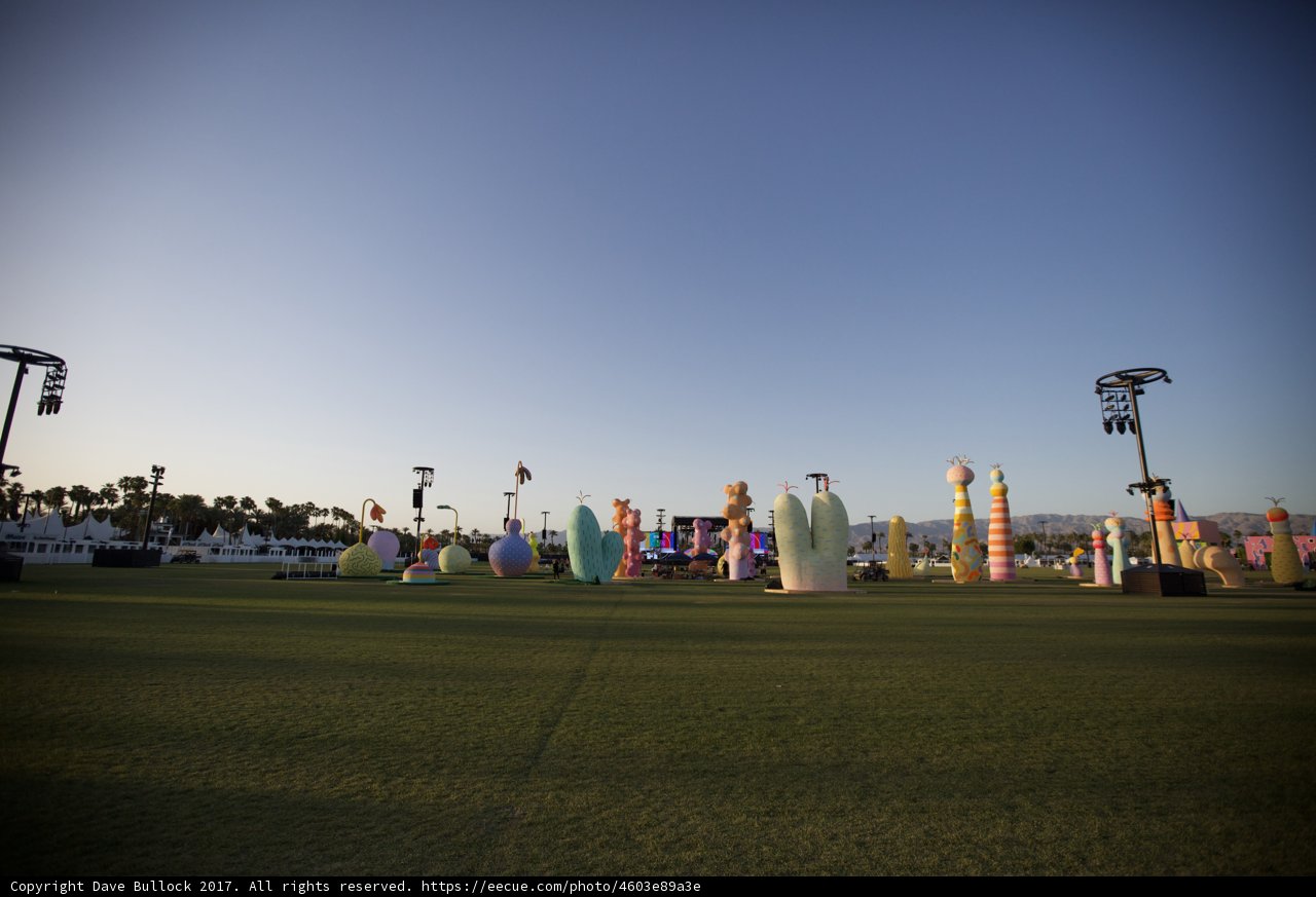 Colorful Statues in a Lively Grass Field