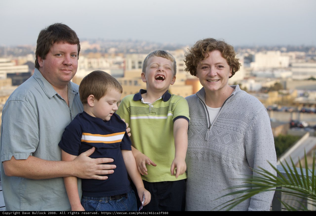 Family Portrait on Urban Rooftop at Dusk