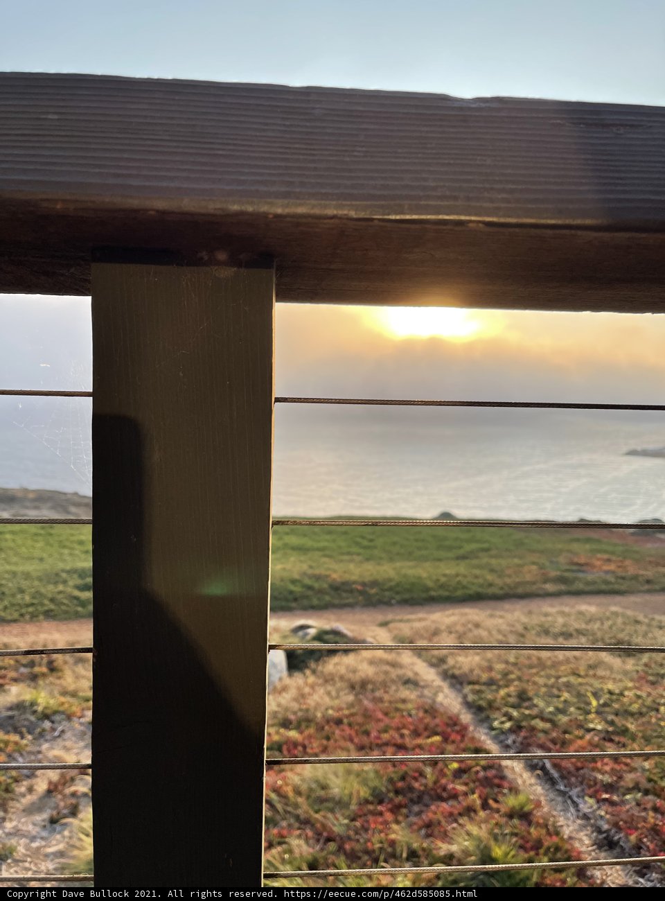 Serene Sunset View from Wooden Fence