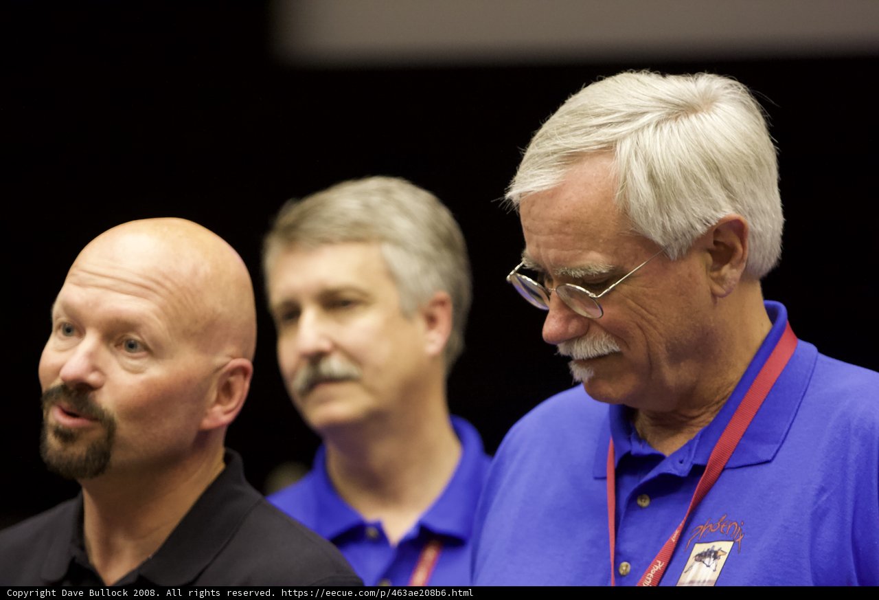 Three Men with White Hair in Blue Shirts