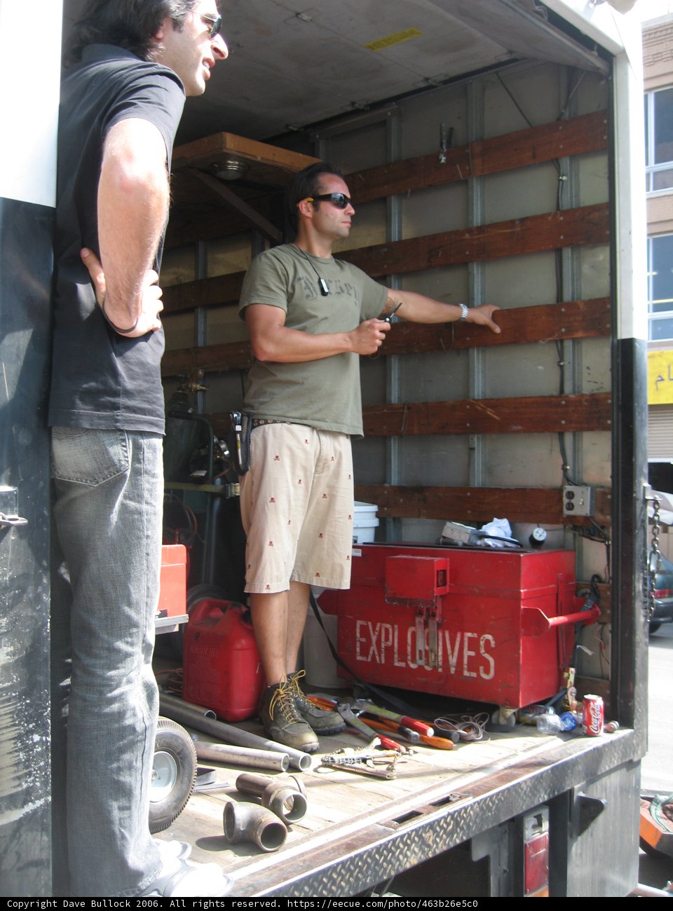 Grey Shirted Men in Plywood Warehouse