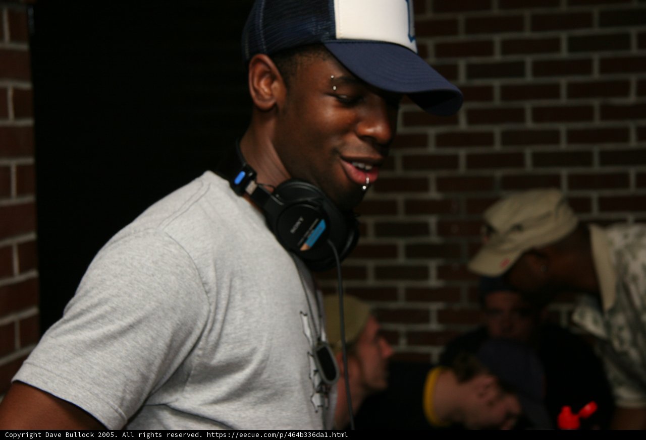 Entertainer in Grey T-Shirt and Brim Cap