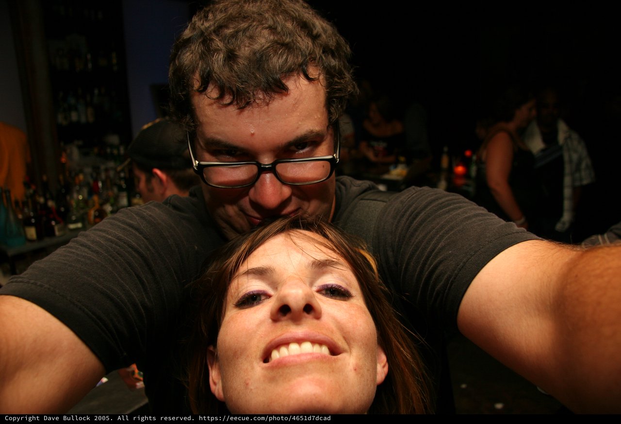 Playful Bar Selfie with Friends at Night