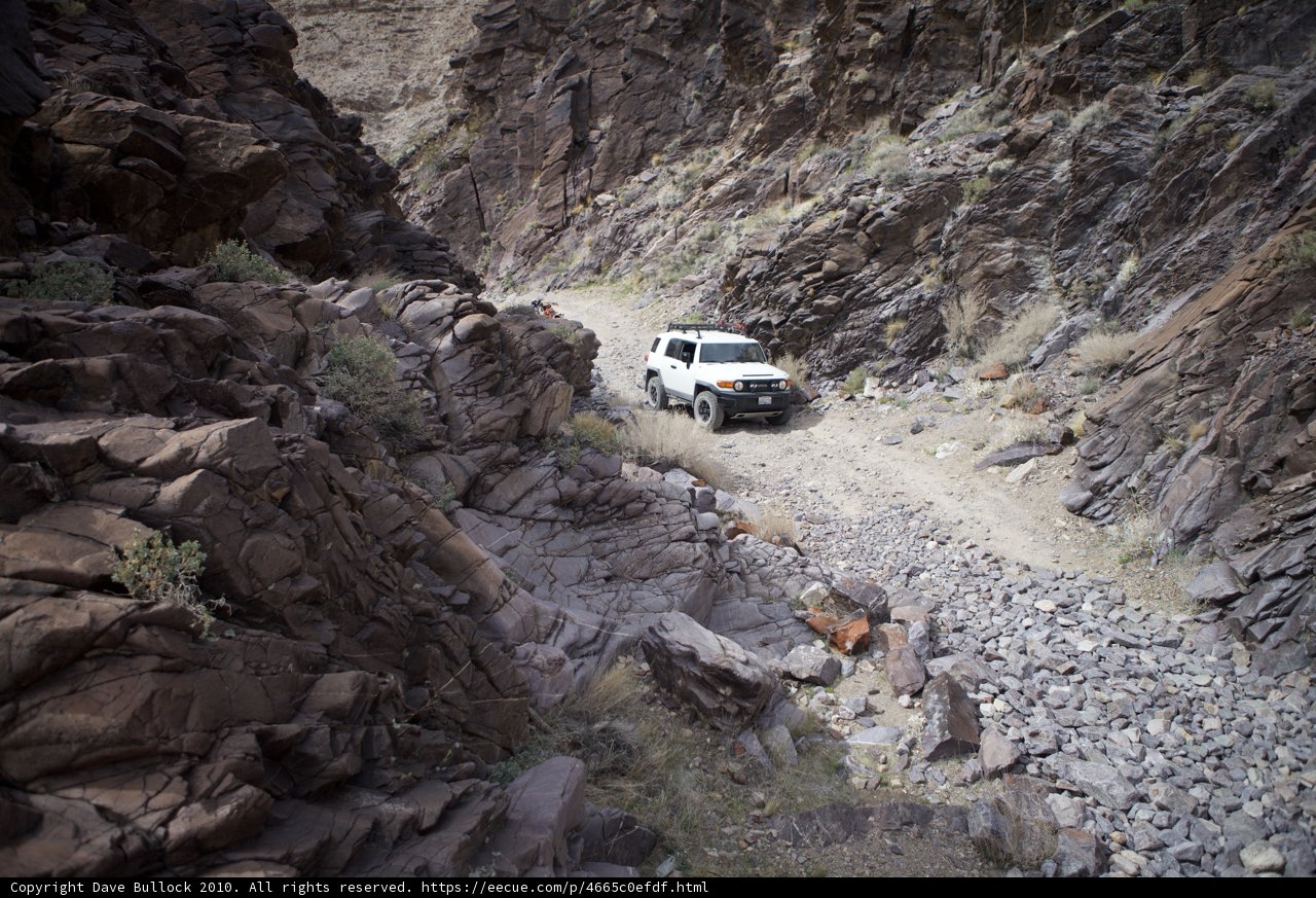 White SUV Takes on Narrow Canyon