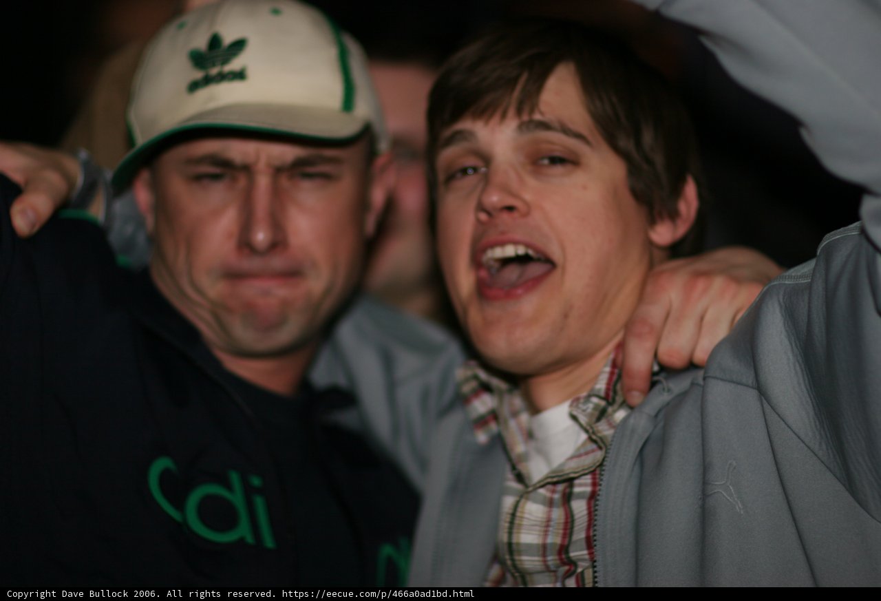 Grey Jacketed Man with Baseball Cap