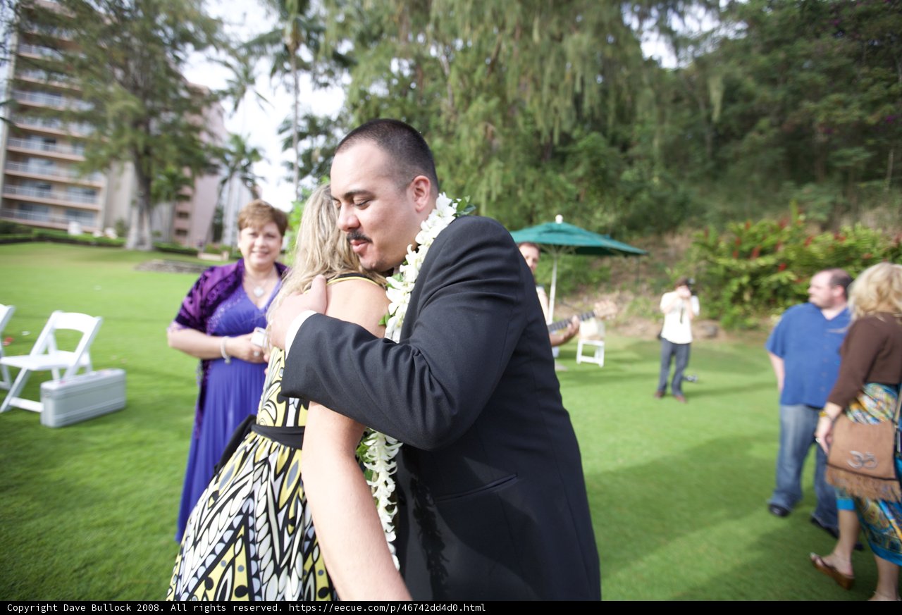 A Loving Embrace at a Hawaiian Wedding