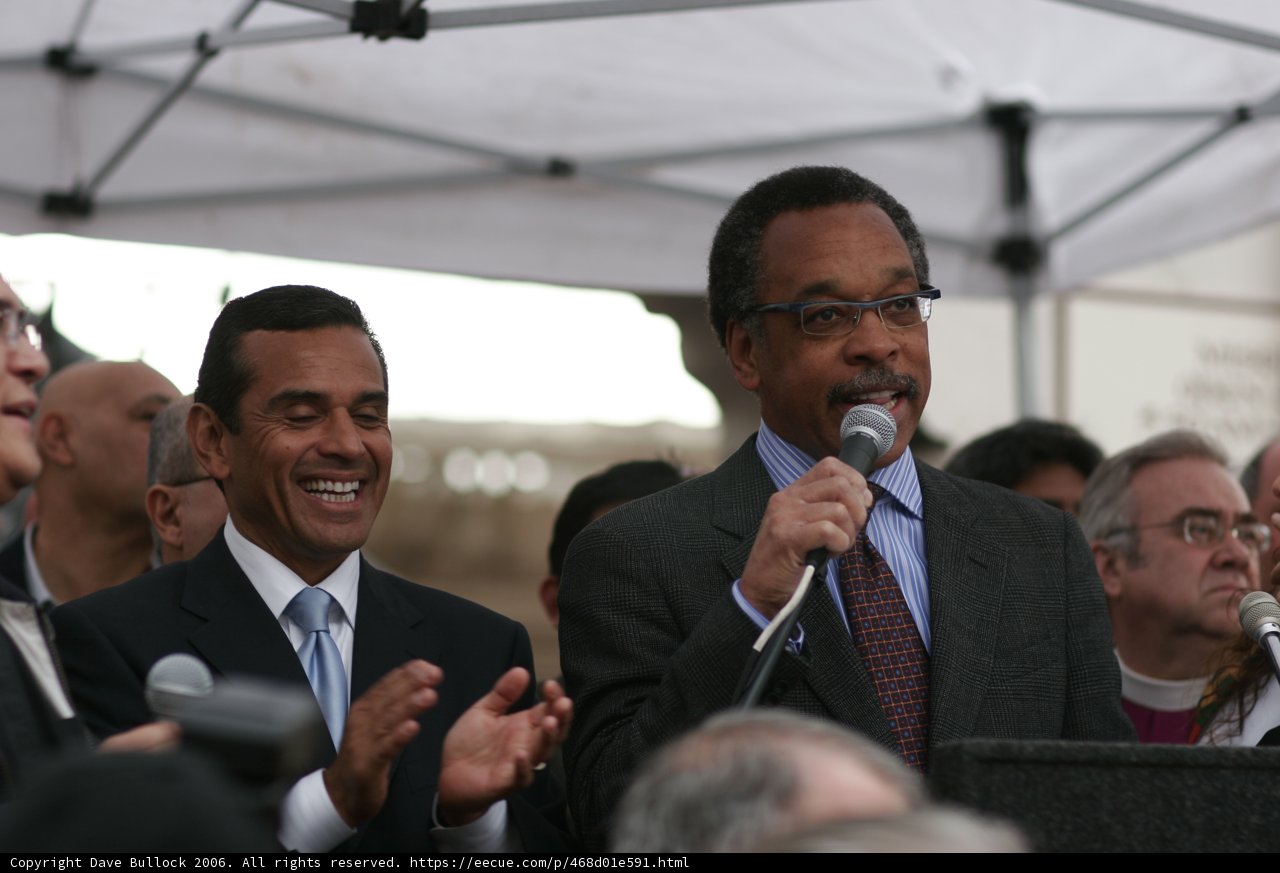 Two Men in Suits and Ties with Microphones