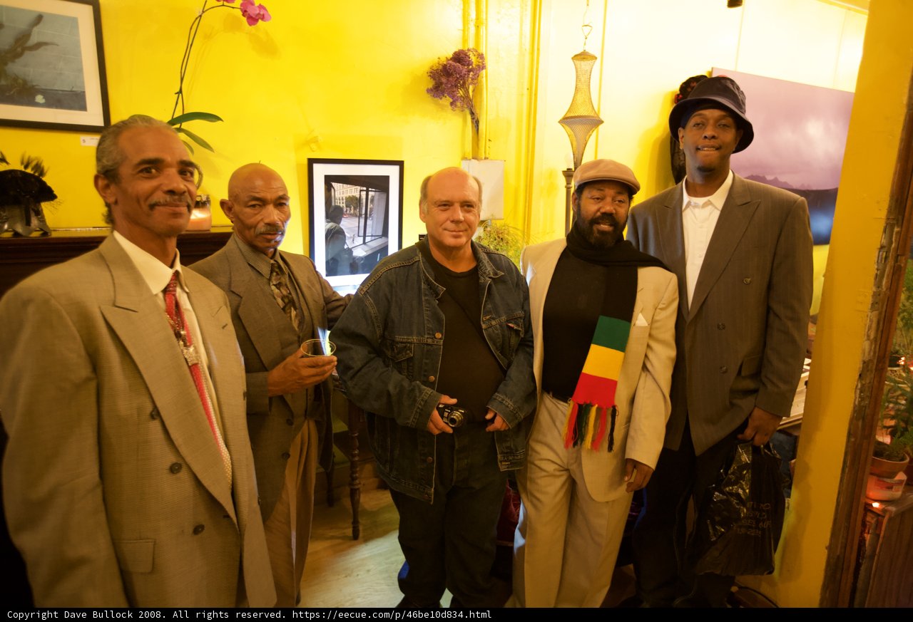 Men in Formal Wear in Front of Yellow Wall