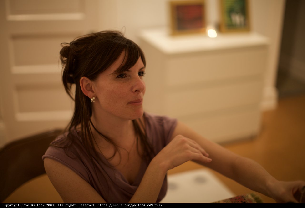 Contemplative Woman at Art Gallery Evening Event
