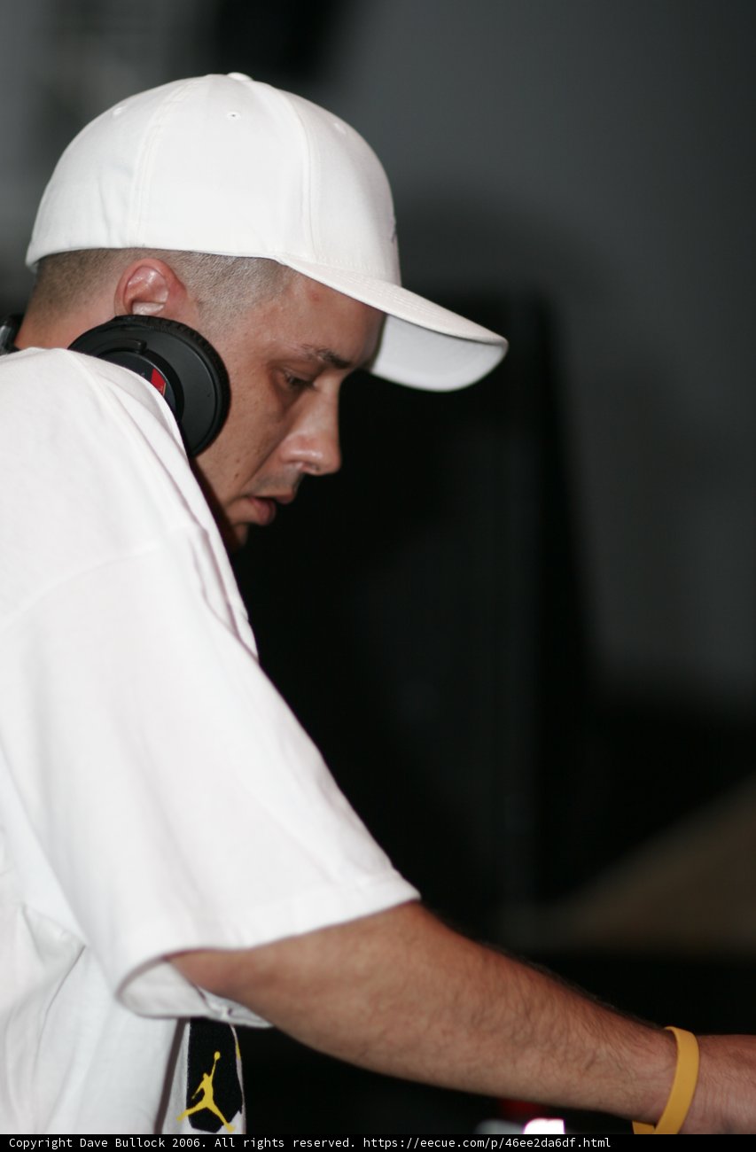 Hat-wearing Man in White Shirt