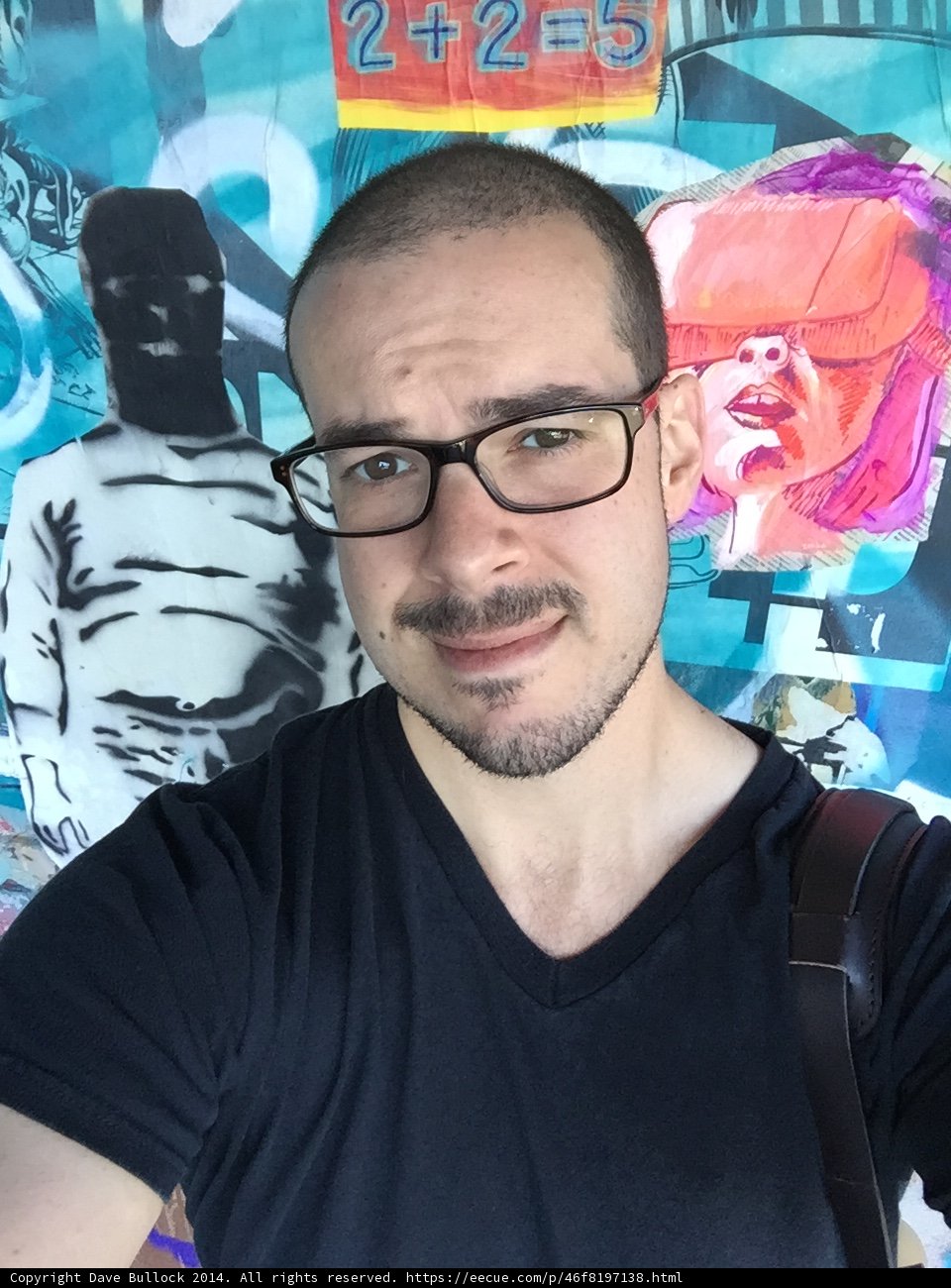 Artful Portrait of Dave B in Front of Graffiti Wall