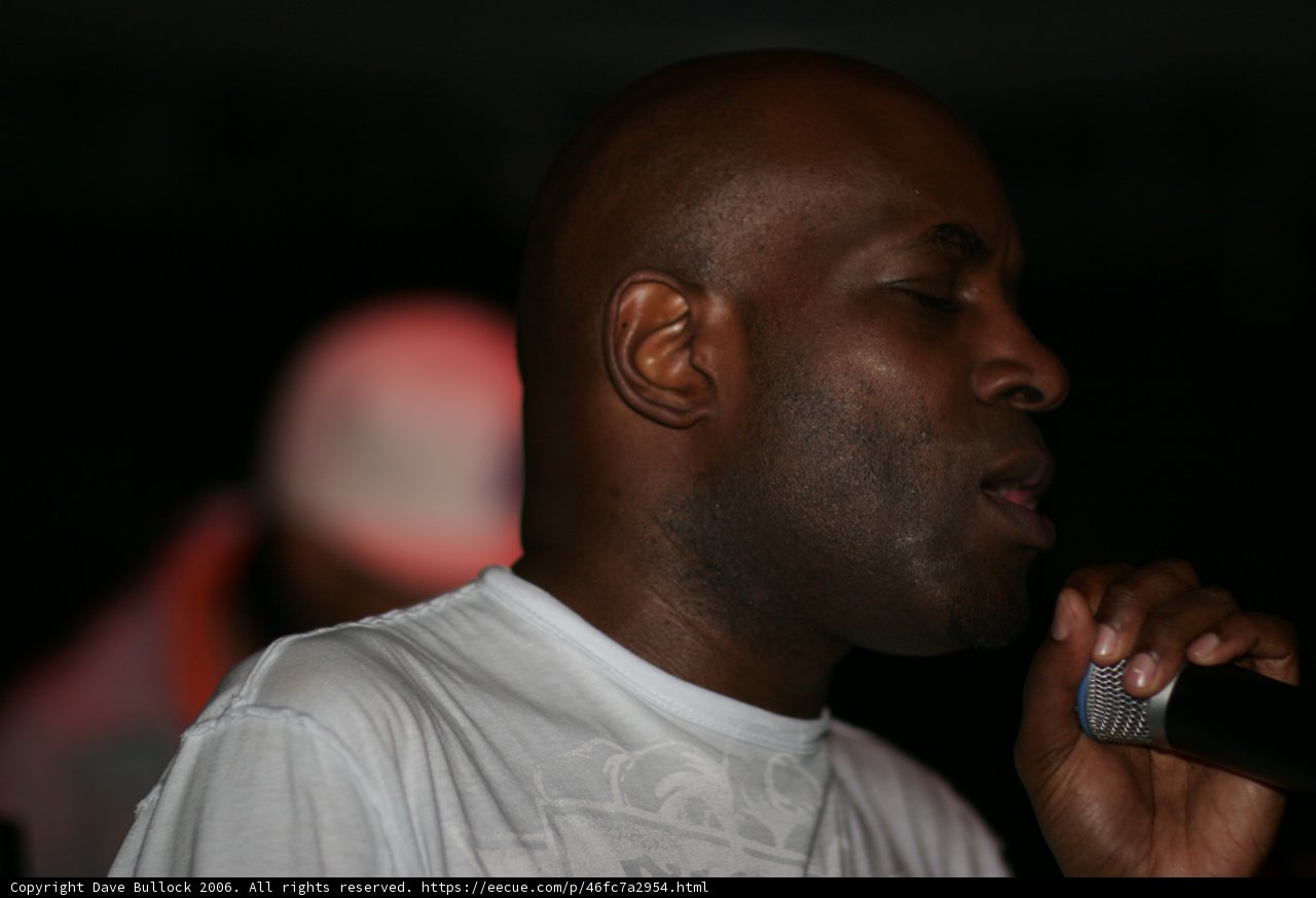 MC Q performing at Club 145