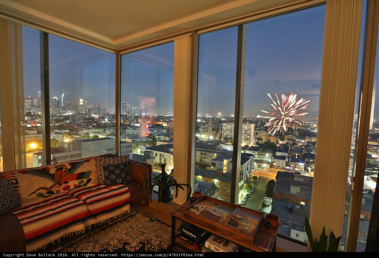 City Lights and Fireworks from a Penthouse Living Room