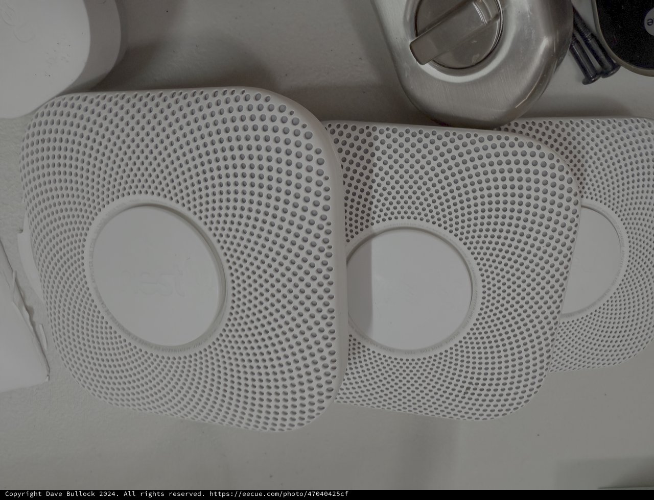 Two White Smoke Detectors in Kitchen Sink