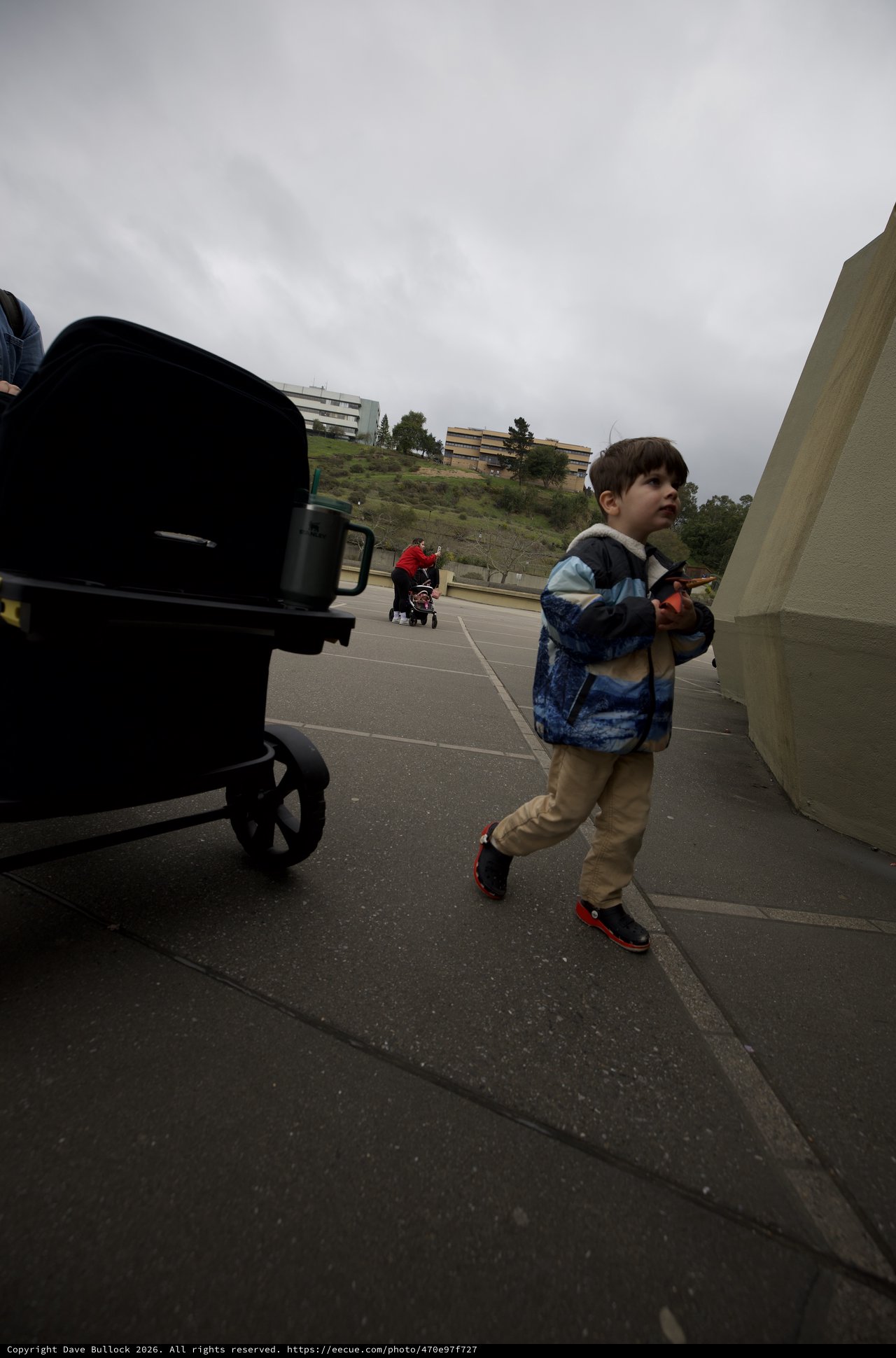 Young Boy Walking on Campus Promenade