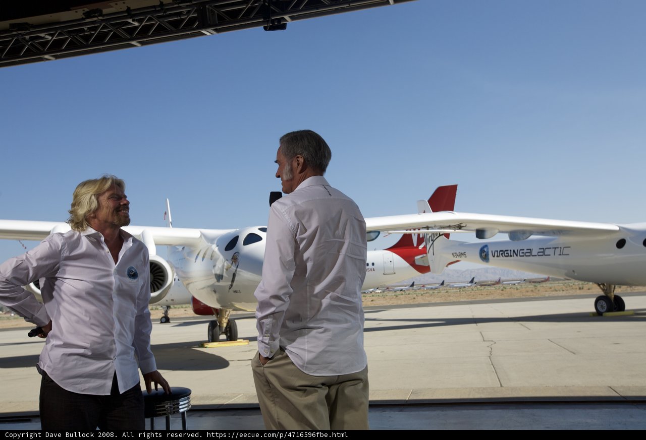 Richard Branson and friends pose in front of aircraft