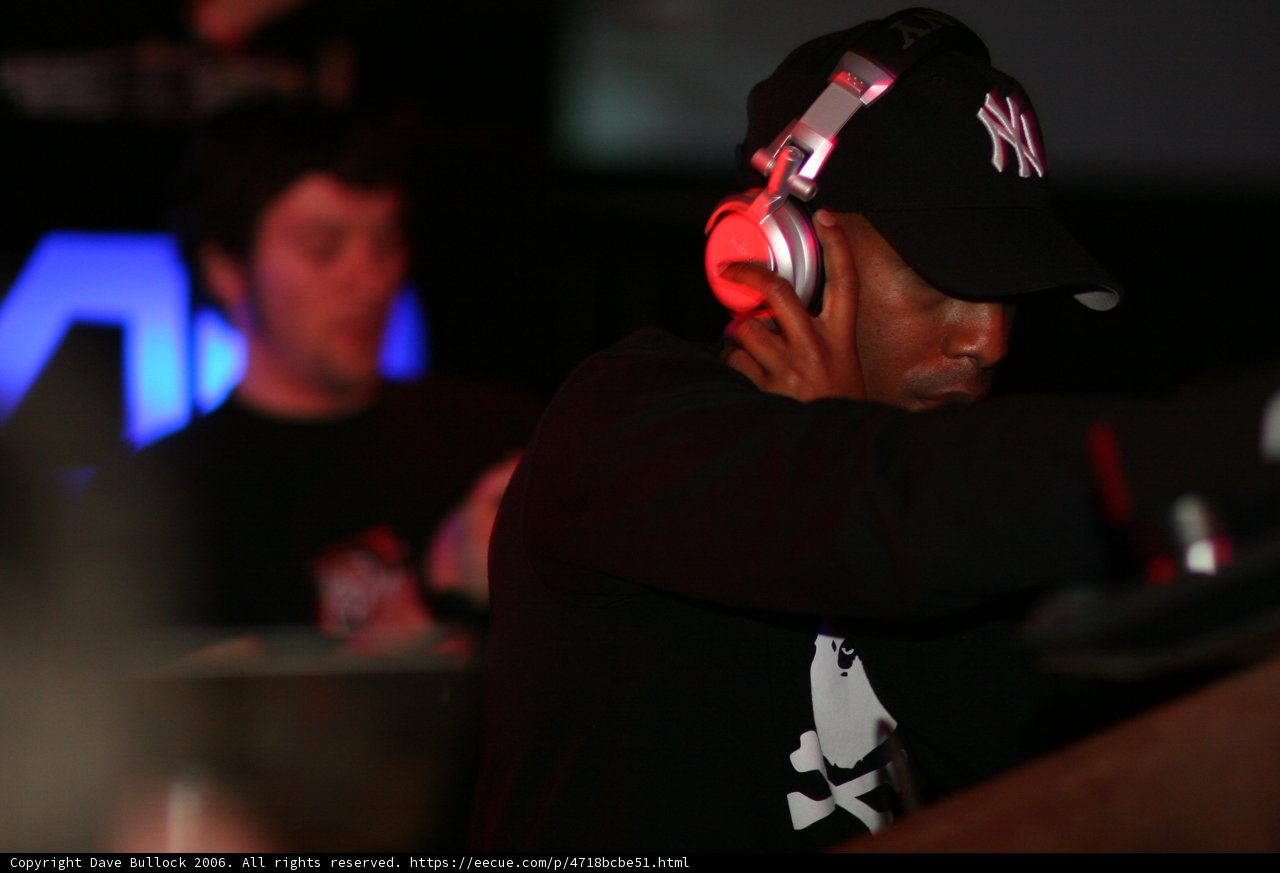 Party-goer rocks a baseball cap and headphones