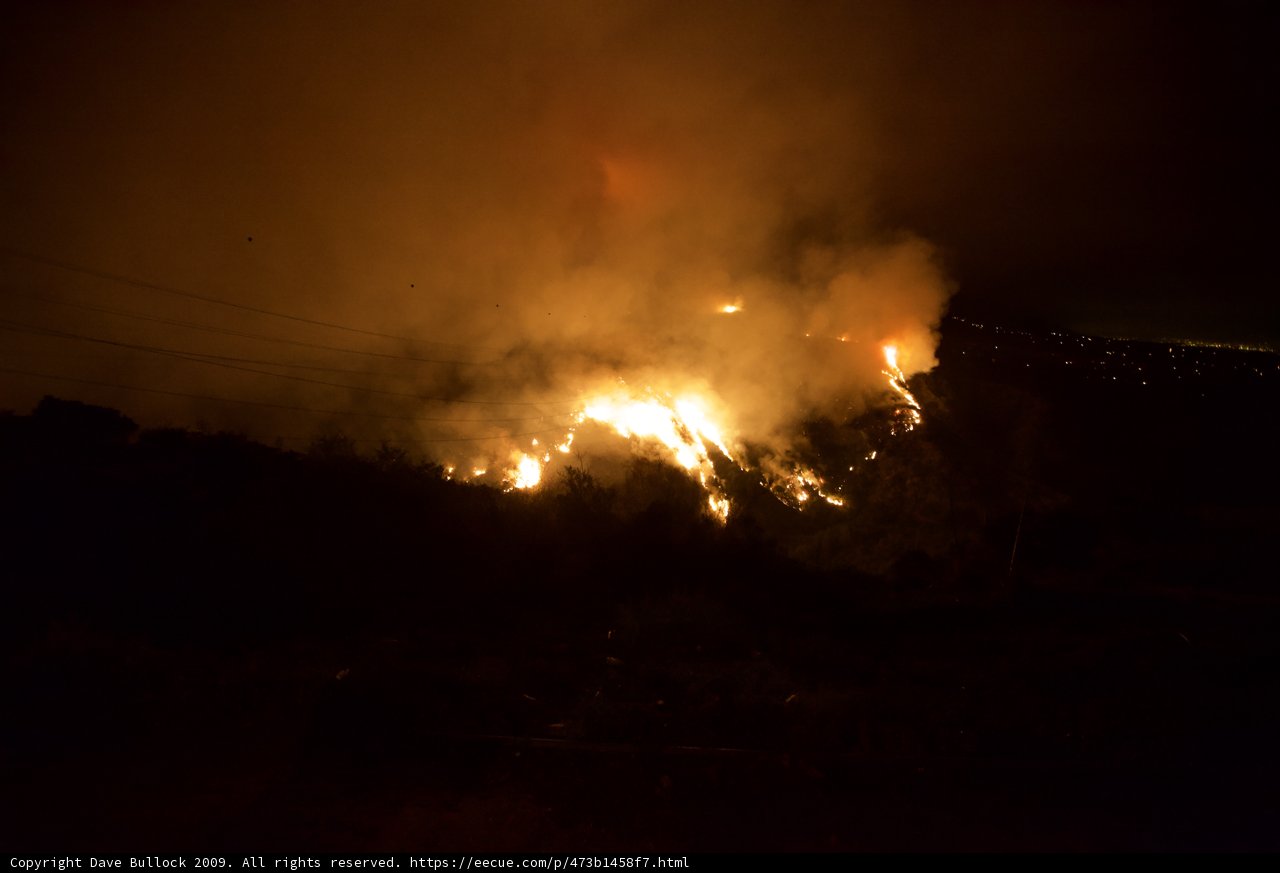 Flames engulf the night sky