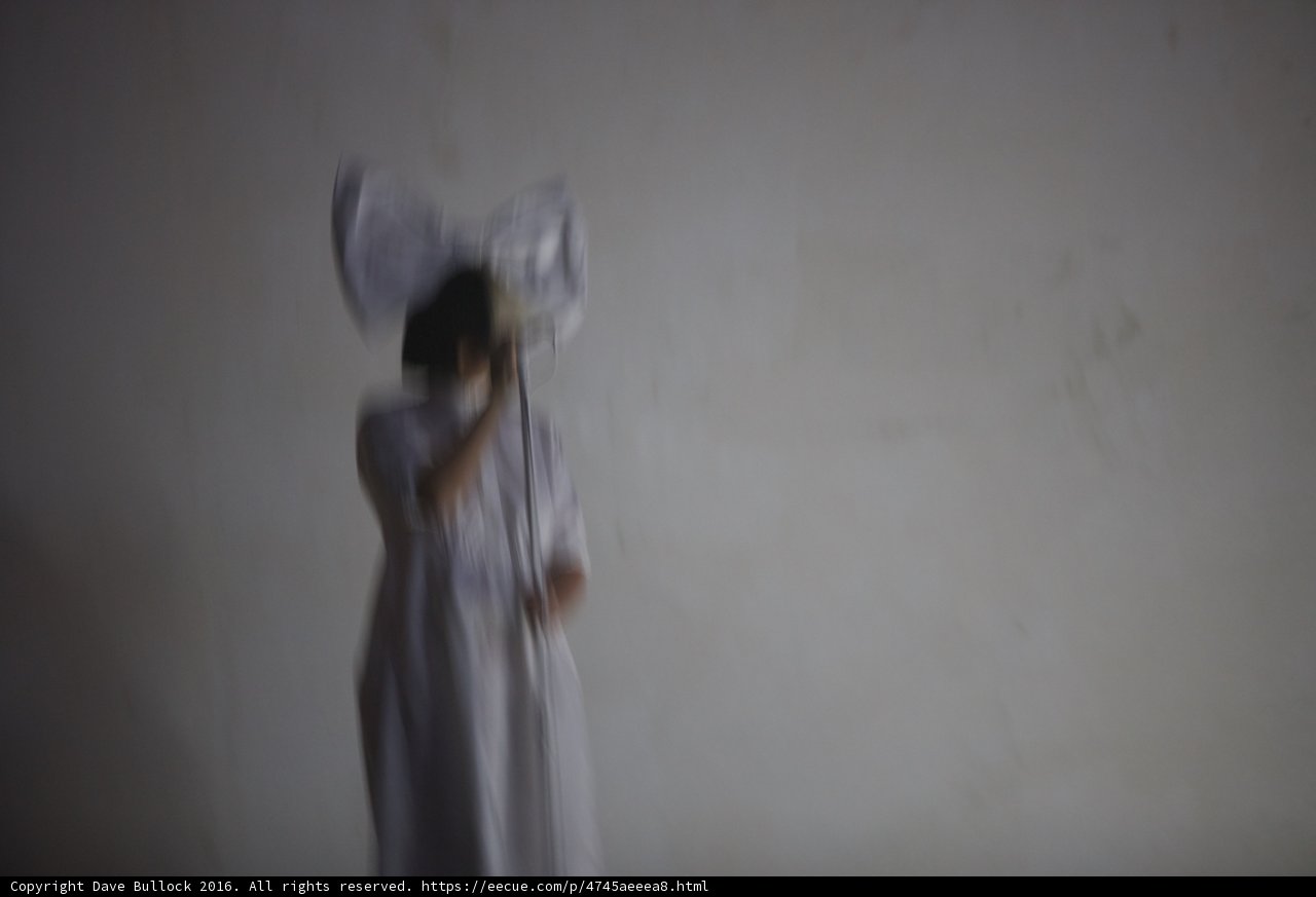 Blurred Beauty in a White Dress