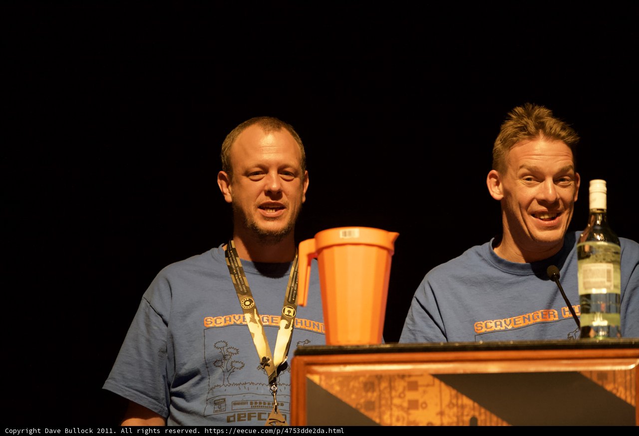 Blue Shirted Men Sharing a Drink