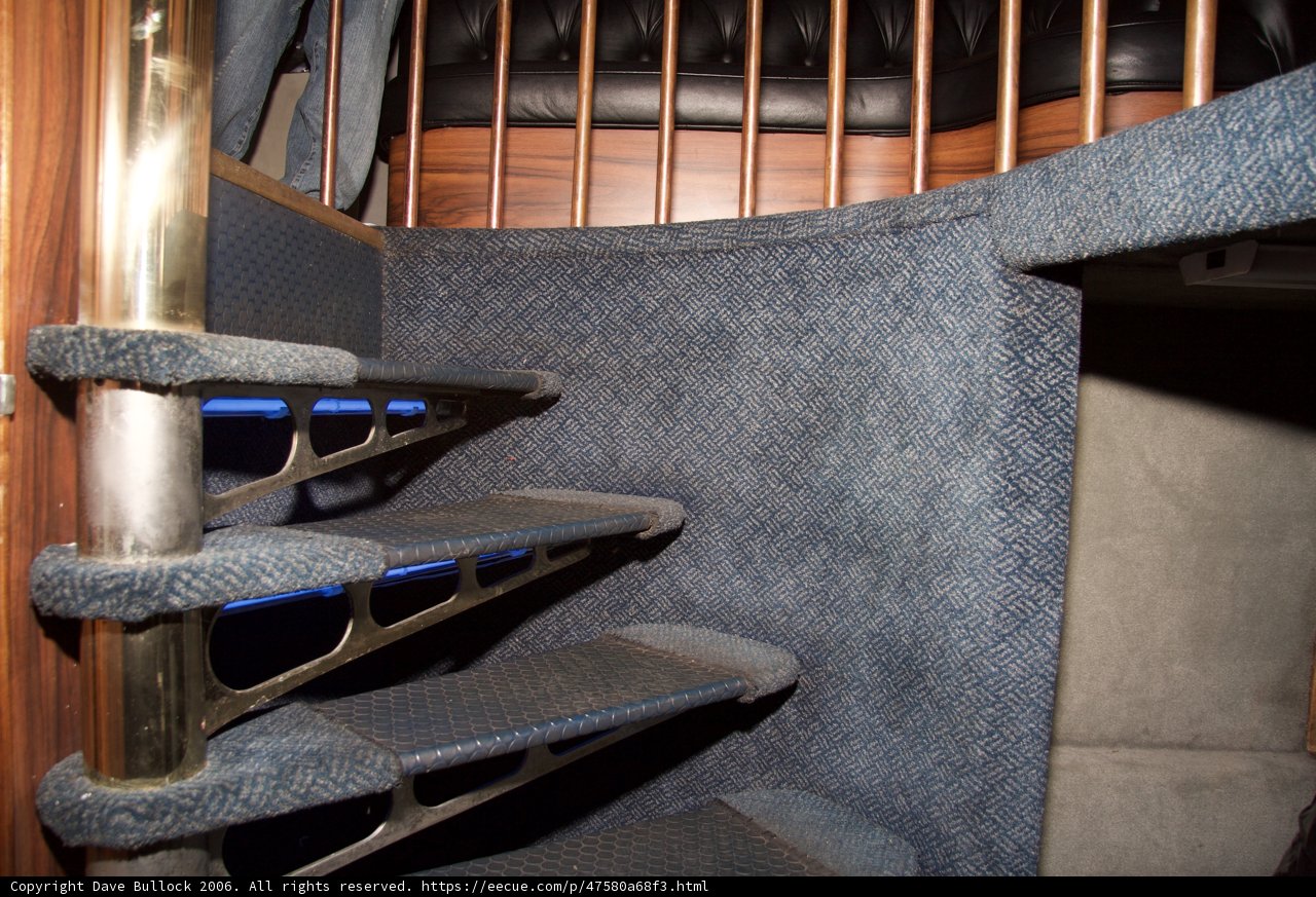 Inside a Blue Bus with a Staircase