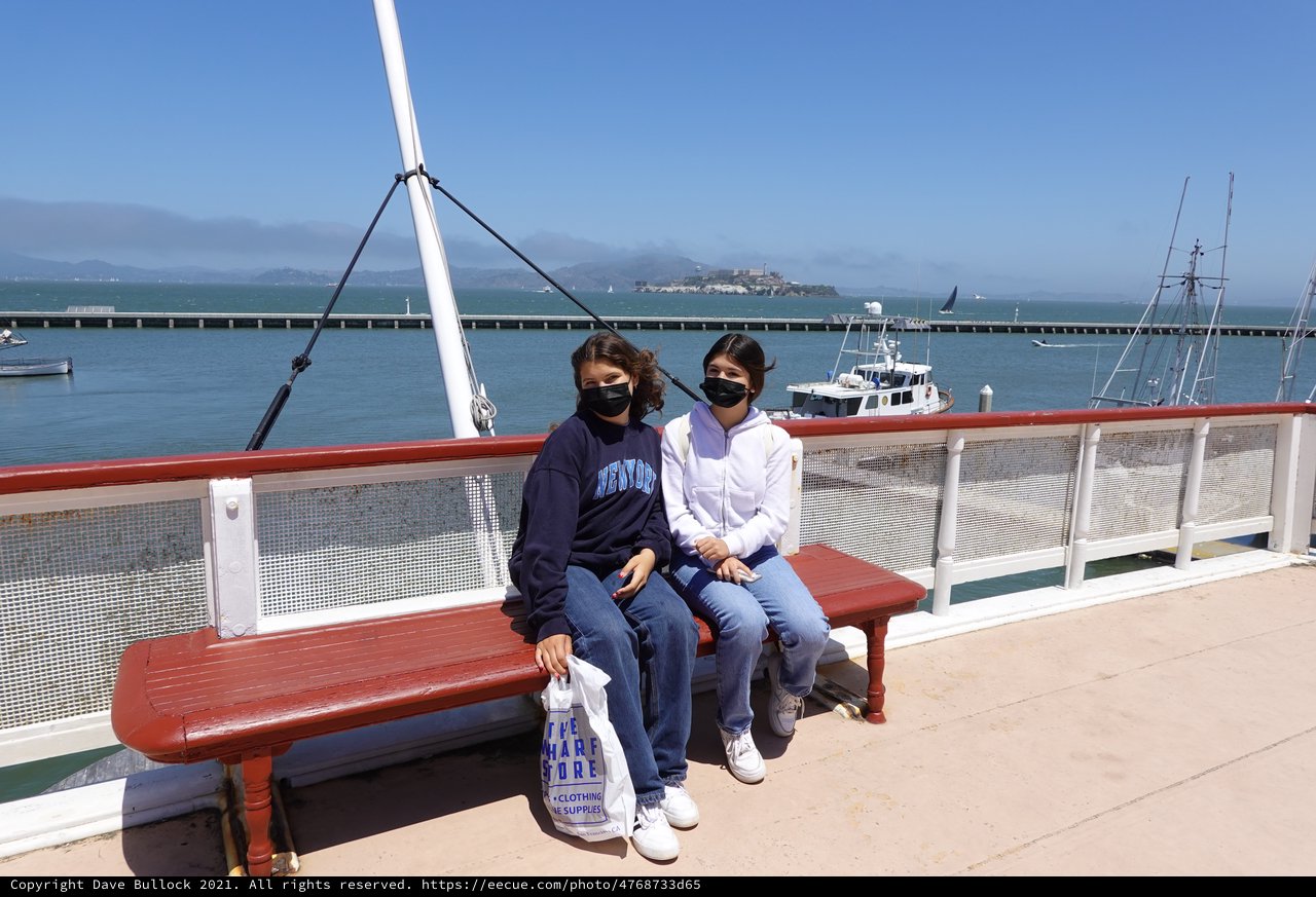Two Friends Enjoying Bay Views from Ferry Deck