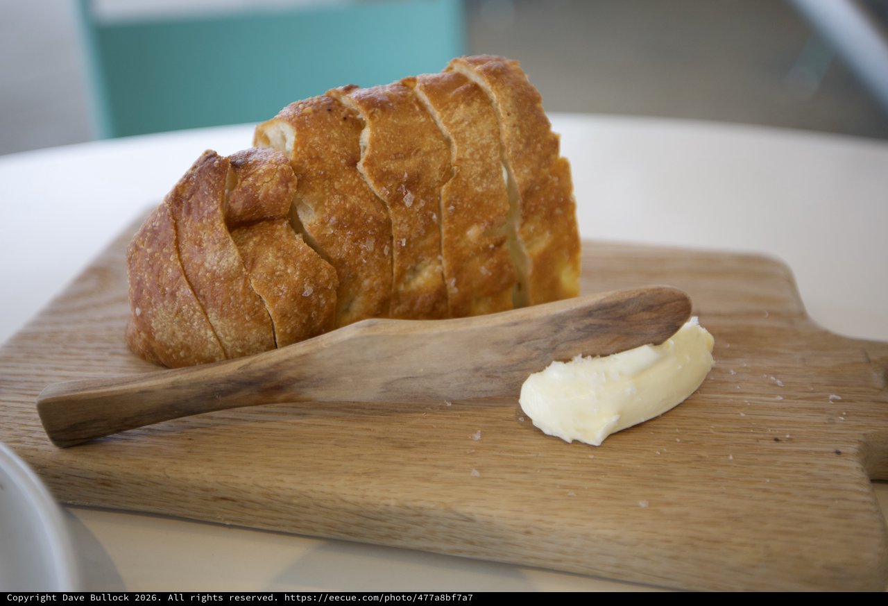 Artisan Bread with Butter on Wooden Board