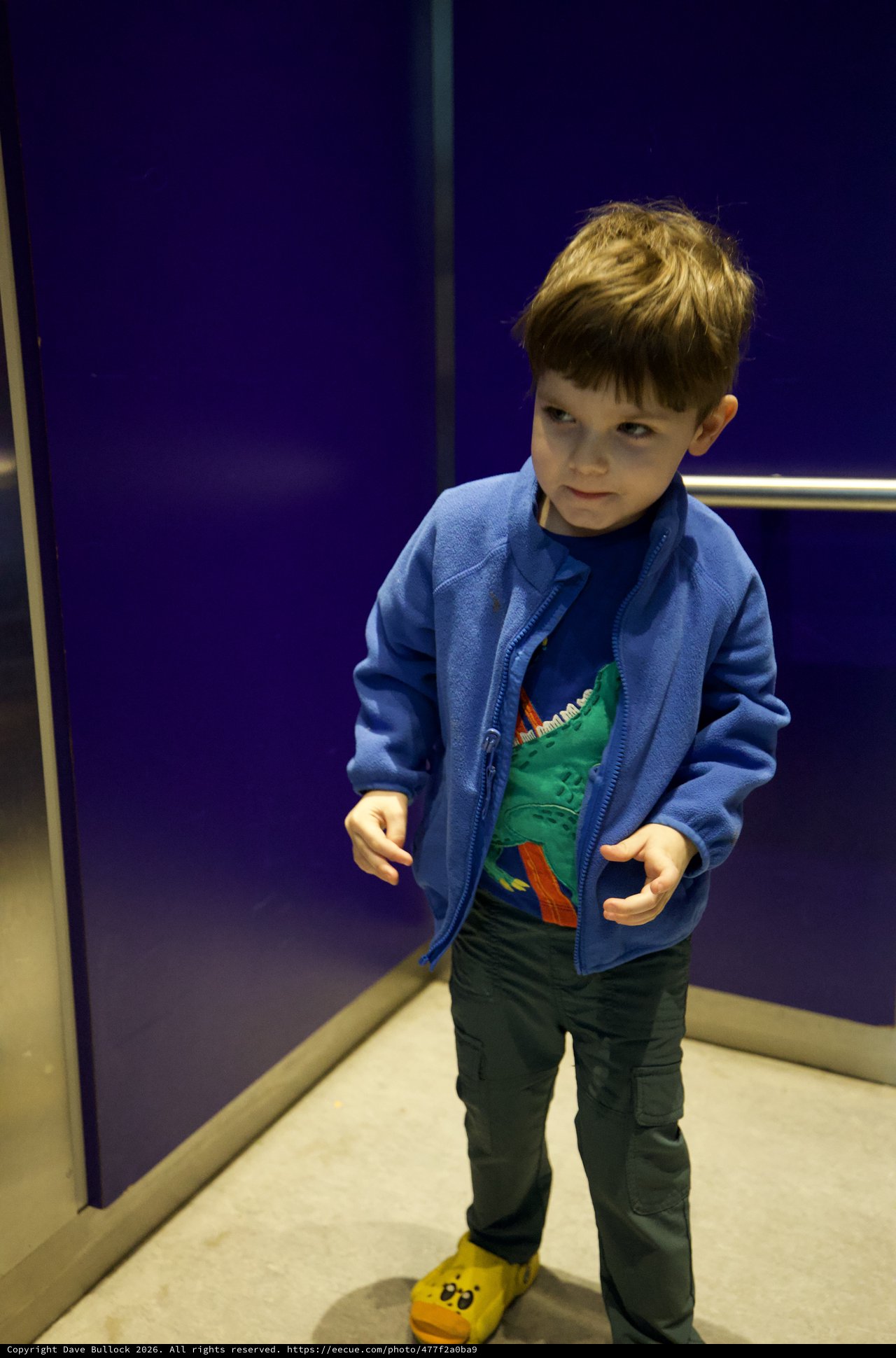 Young Boy in Blue Jacket at Science Center