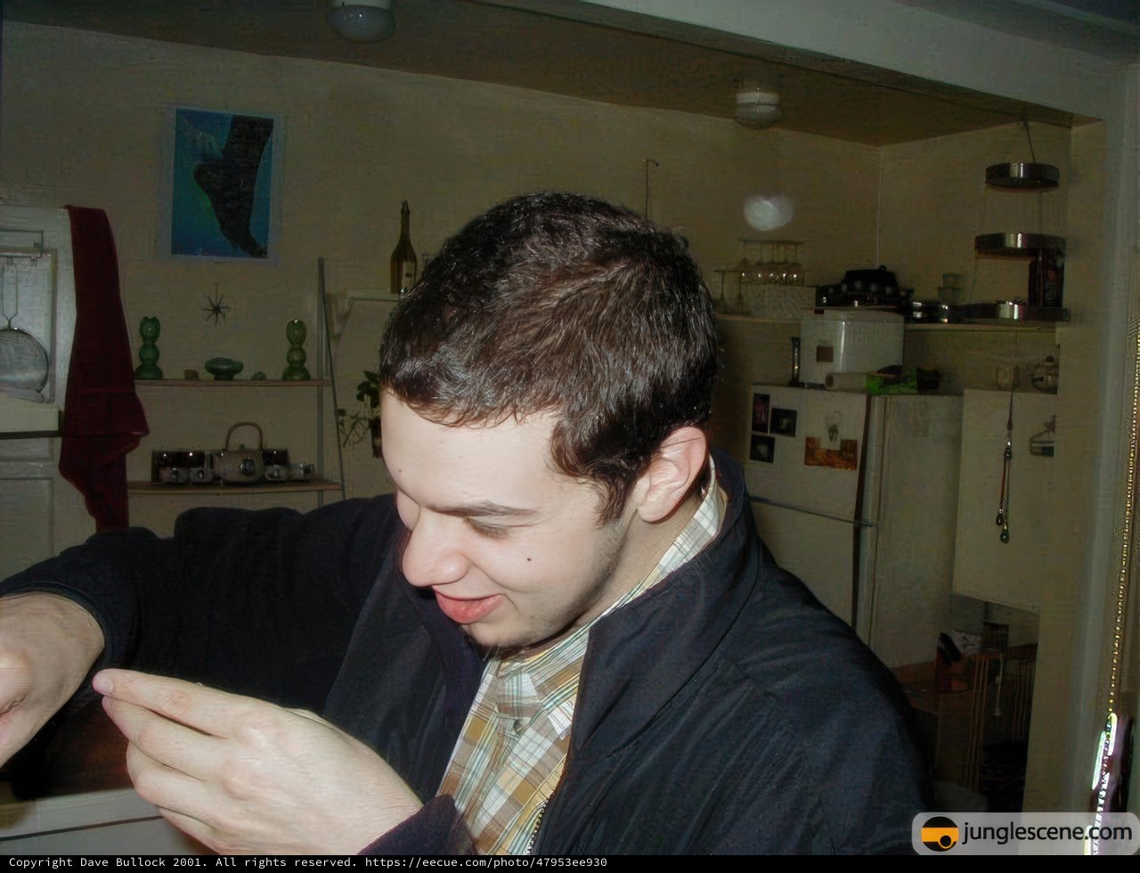 Man Enjoying a Sandwich in Formal Wear