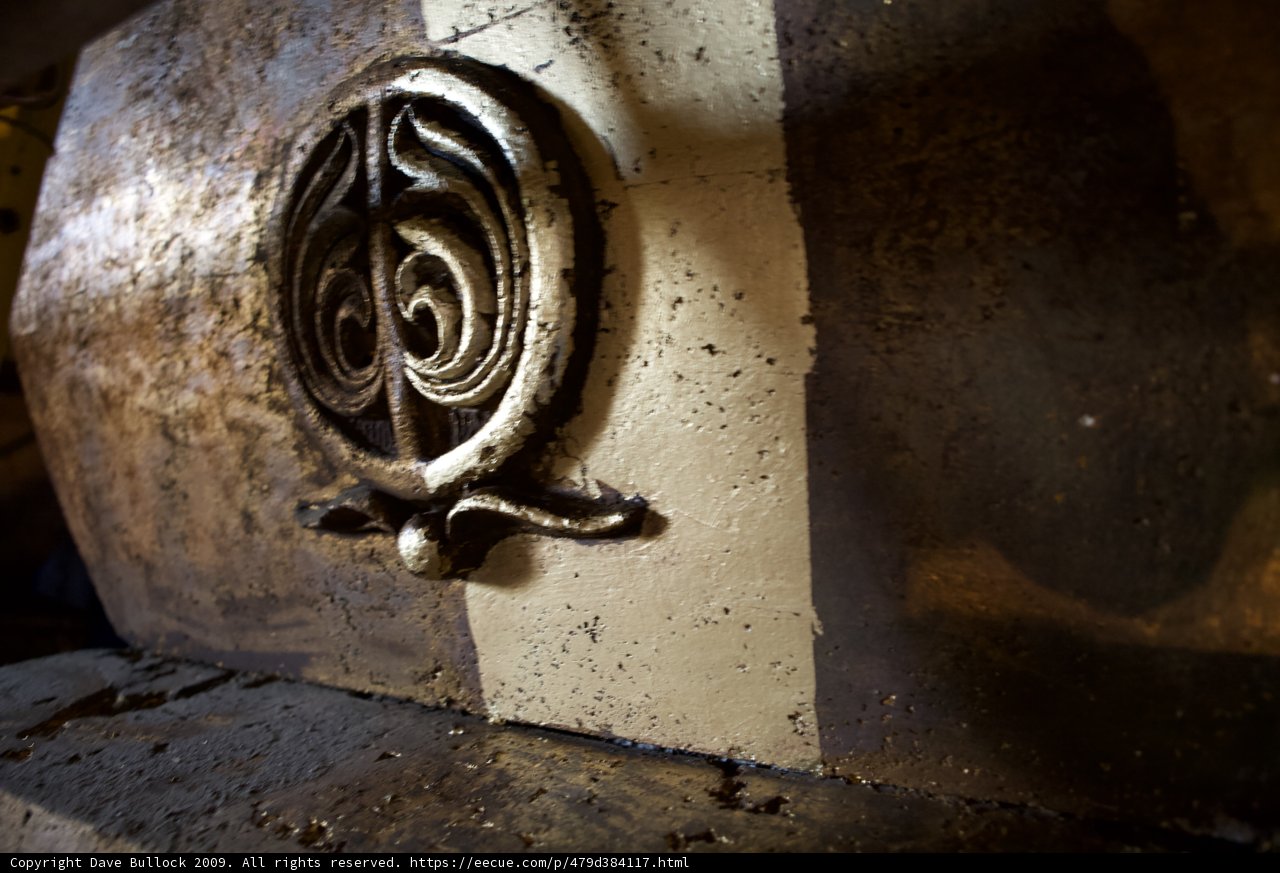 Cryptic Symbol on Bronze Handrail