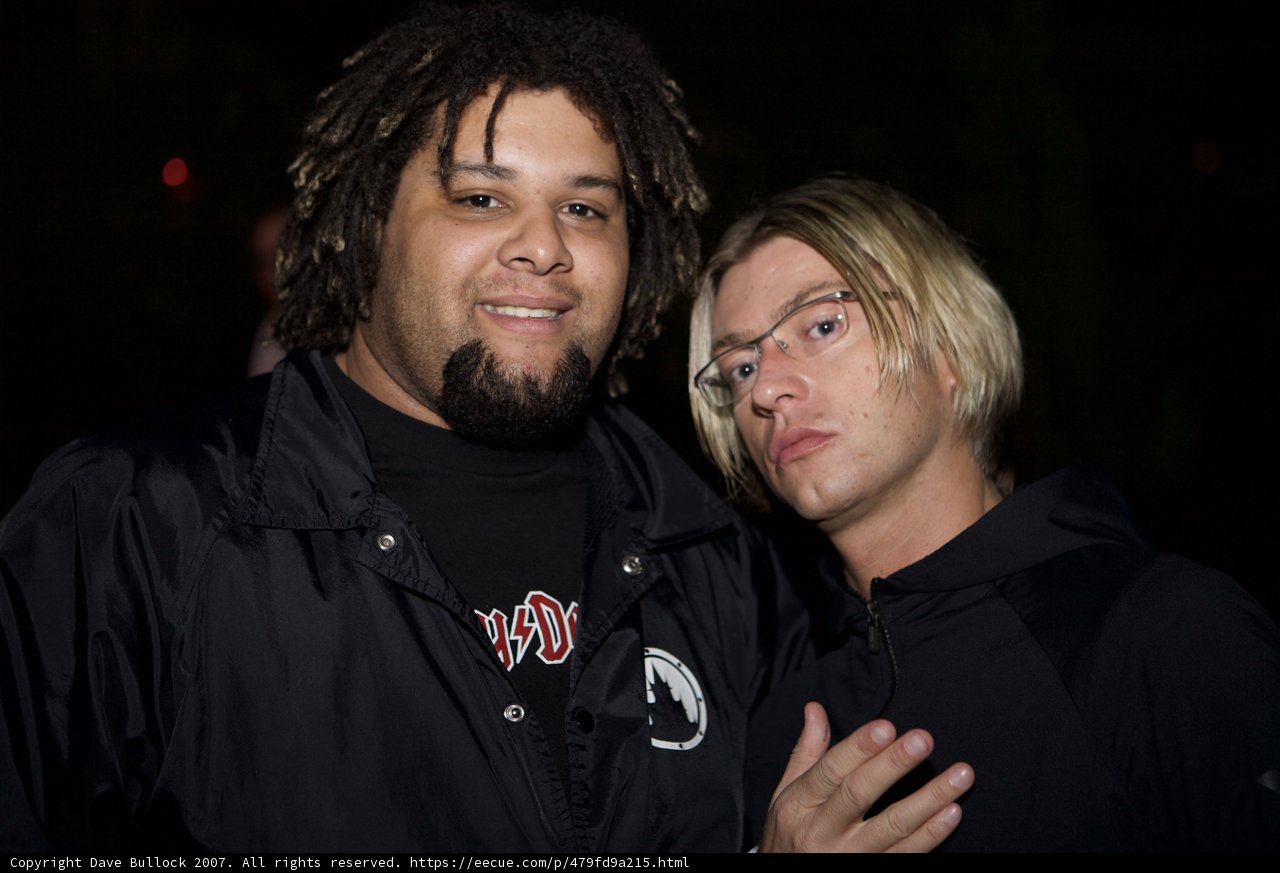 Two Men Sporting Trendy Outfits