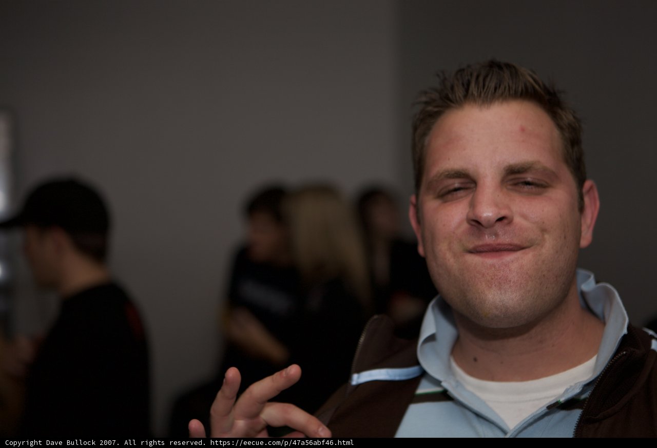 White Shirted Man in a Crowd
