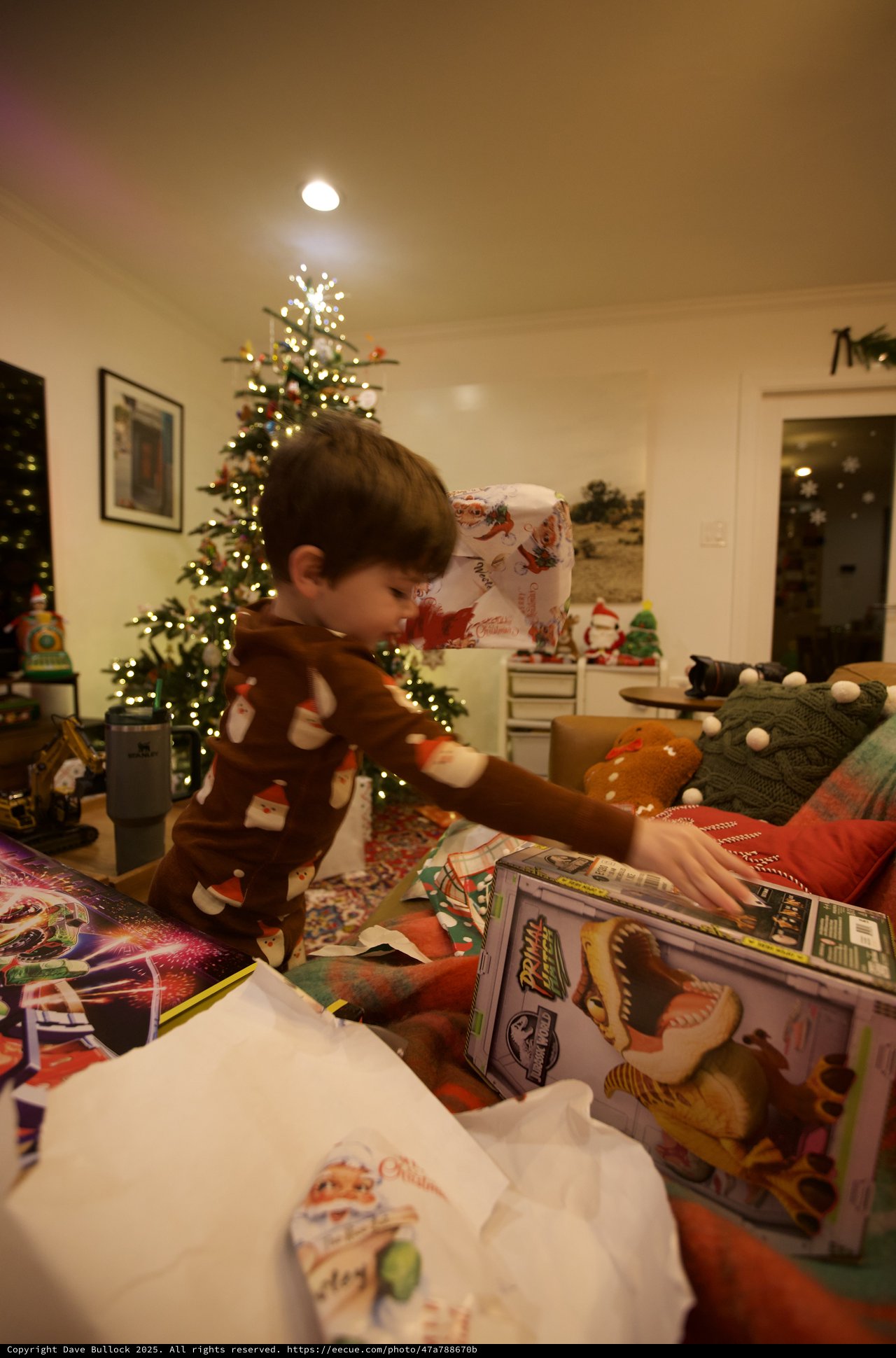 Child Opening Christmas Presents on Holiday Morning