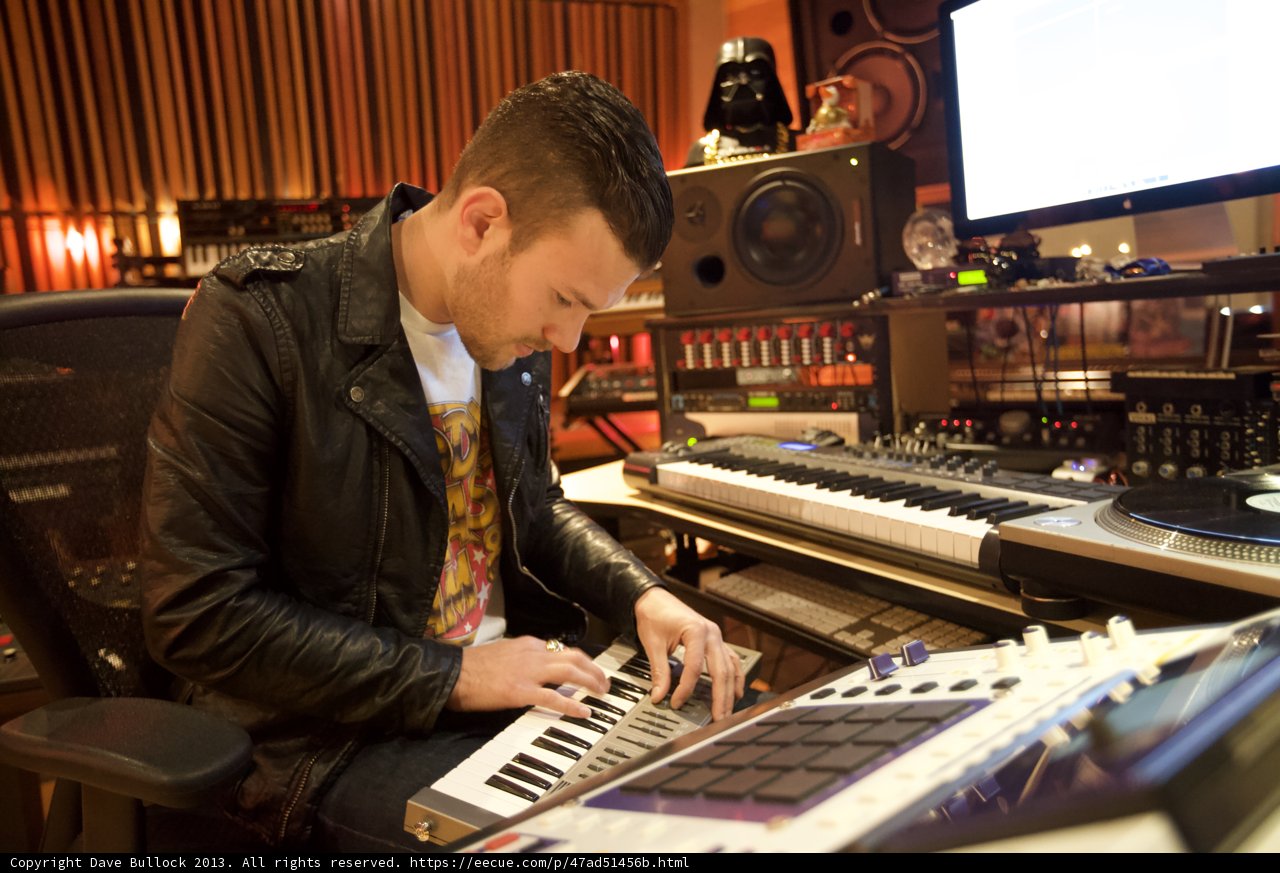 Leather Jacketed Musician Playing Electronic Keyboard