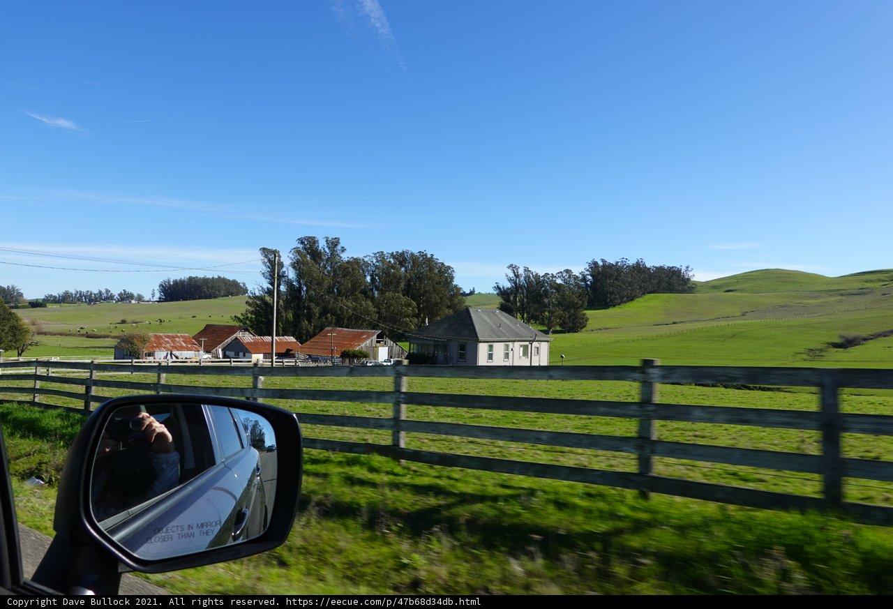 Scenic View of Countryside Farm and House