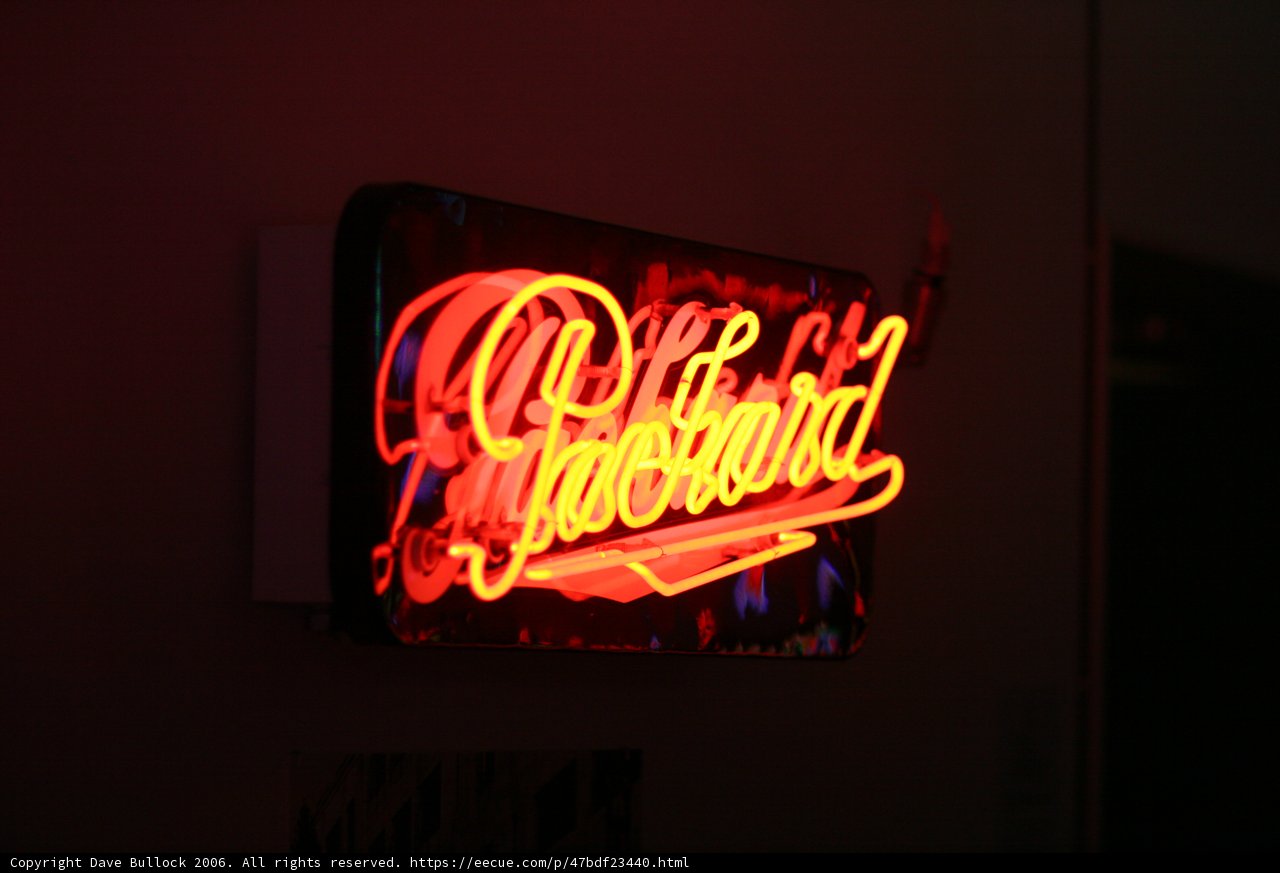 Neon "Pussy" sign at a restaurant