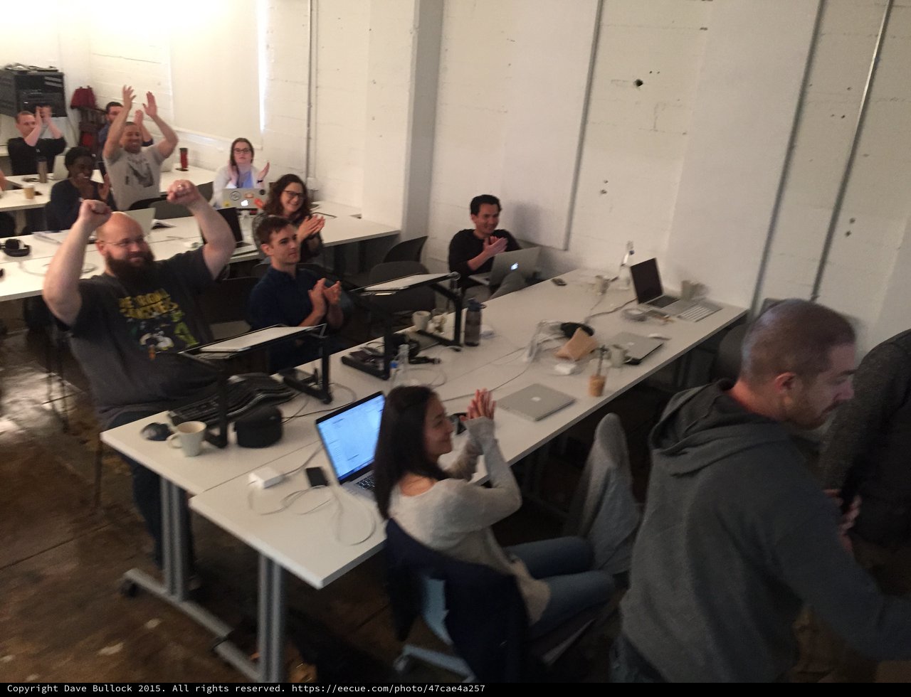 Enthusiastic Group Celebration at Tech Workshop Event
