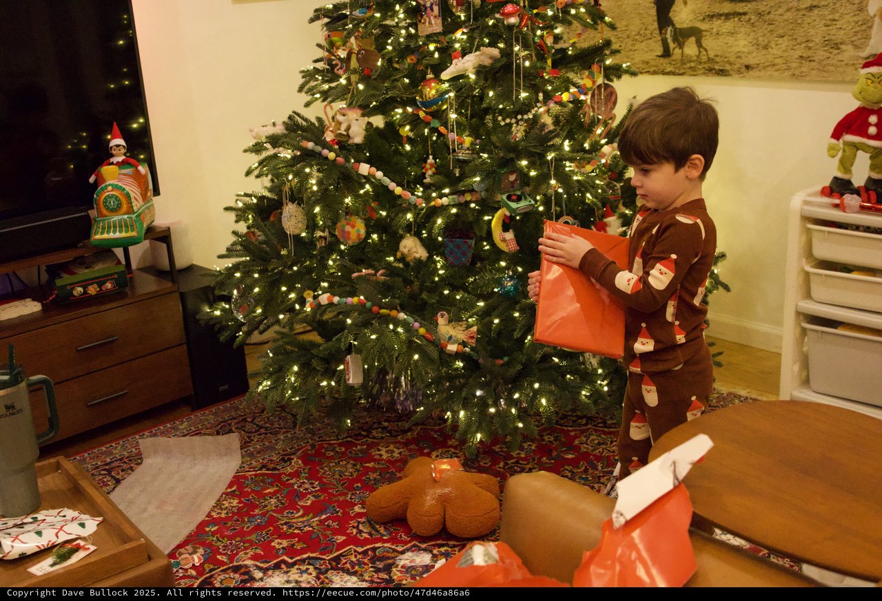 Child Opening Presents on Christmas Morning